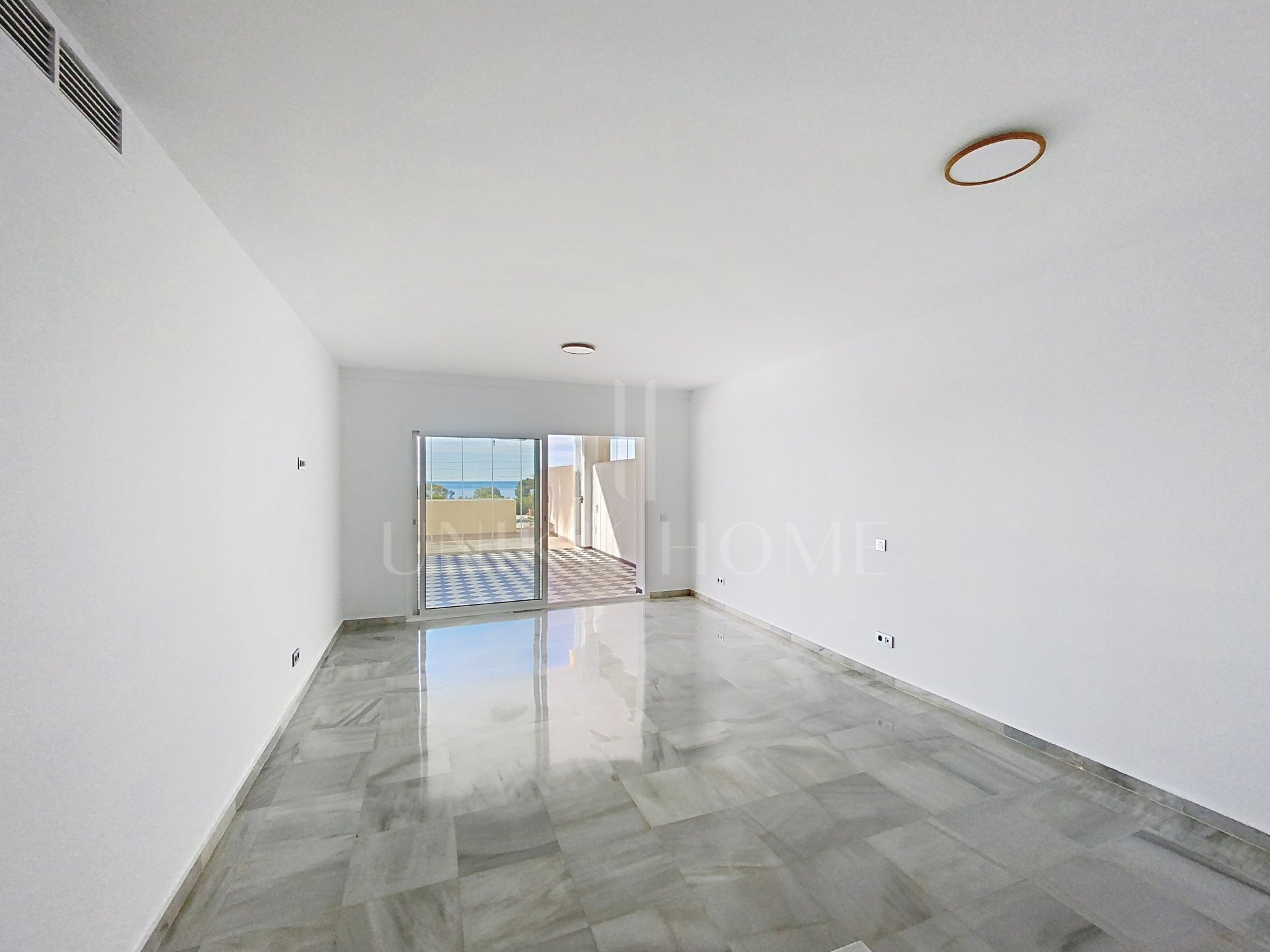 Elevated Ground Floor Sea View Apartment for Sale in Estepona East – Large Terraces & Jacuzzi