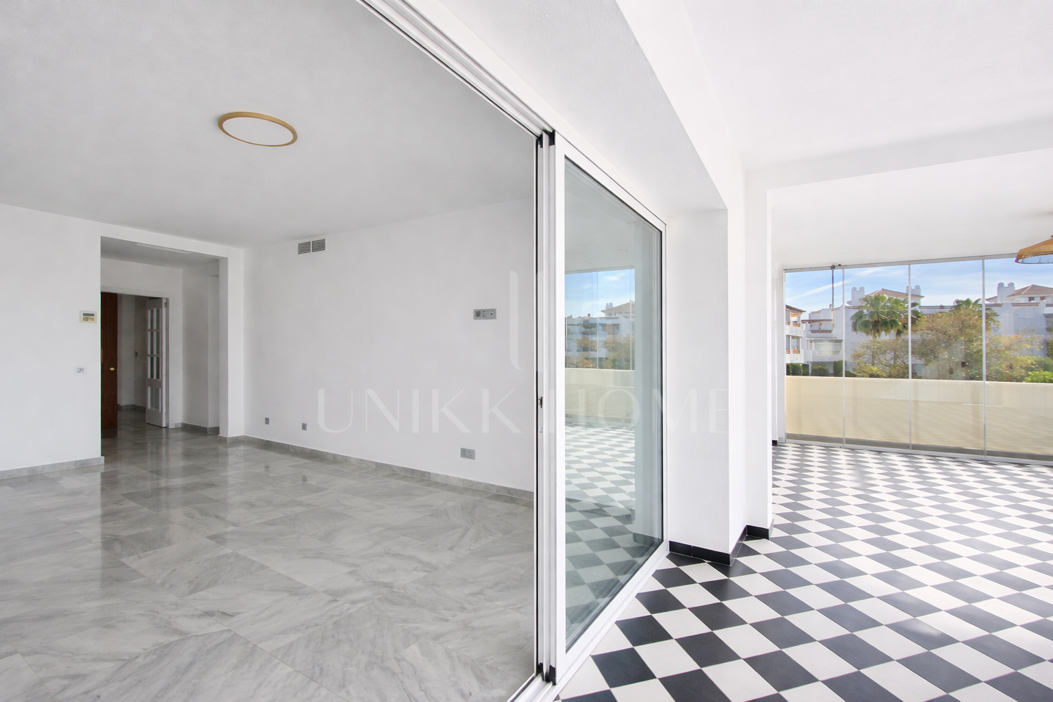 Elevated Ground Floor Sea View Apartment for Sale in Estepona East – Large Terraces & Jacuzzi