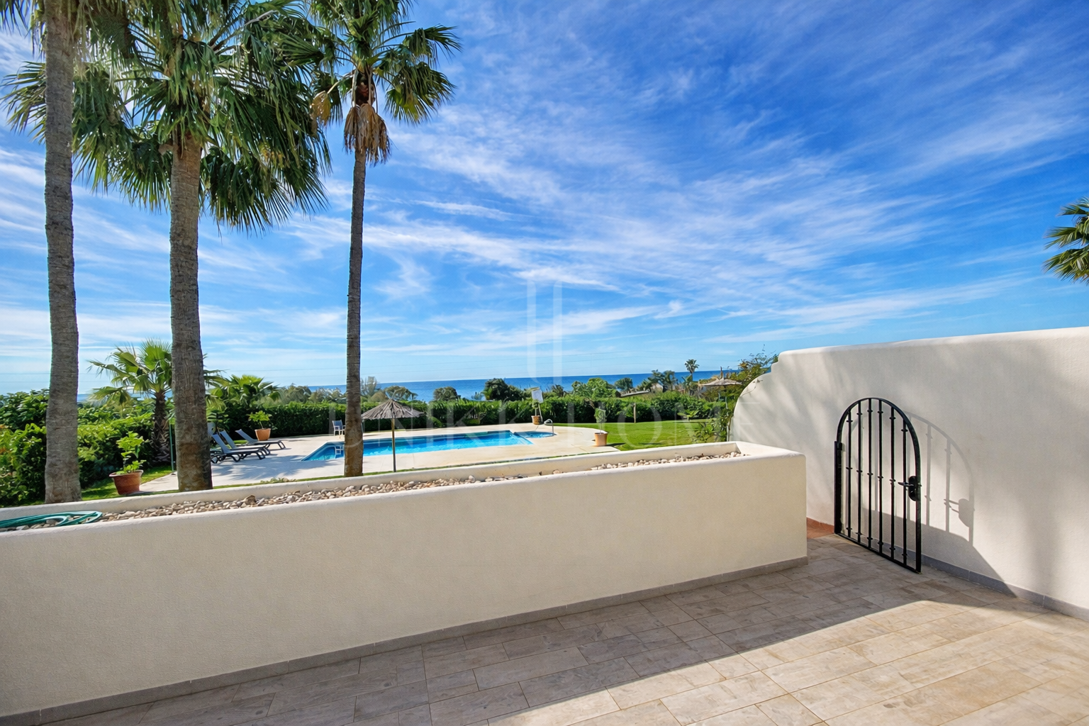 Elevated Ground Floor Sea View Apartment for Sale in Estepona East – Large Terraces & Jacuzzi