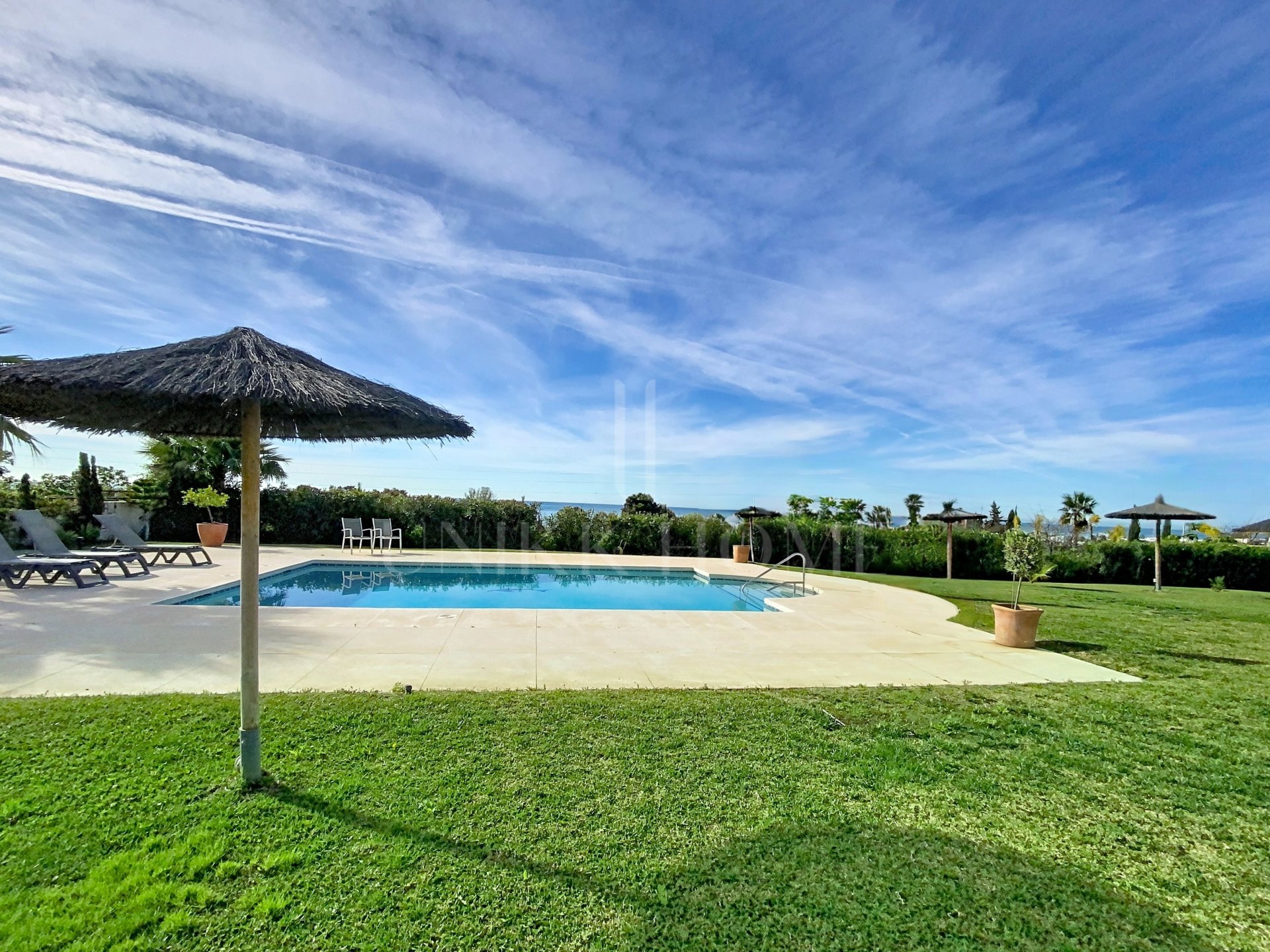 Elevated Ground Floor Sea View Apartment for Sale in Estepona East – Large Terraces & Jacuzzi