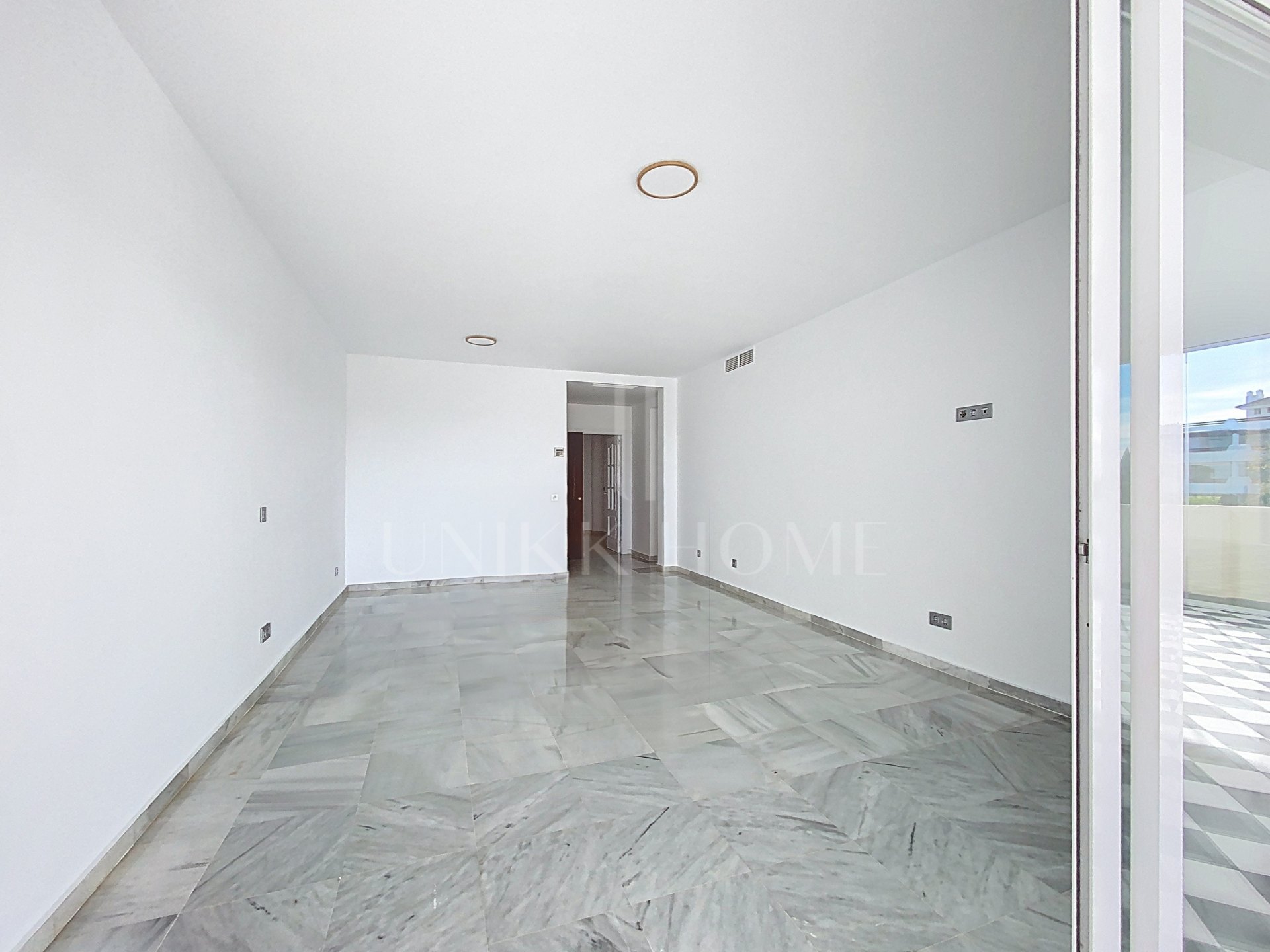 Elevated Ground Floor Sea View Apartment for Sale in Estepona East – Large Terraces & Jacuzzi