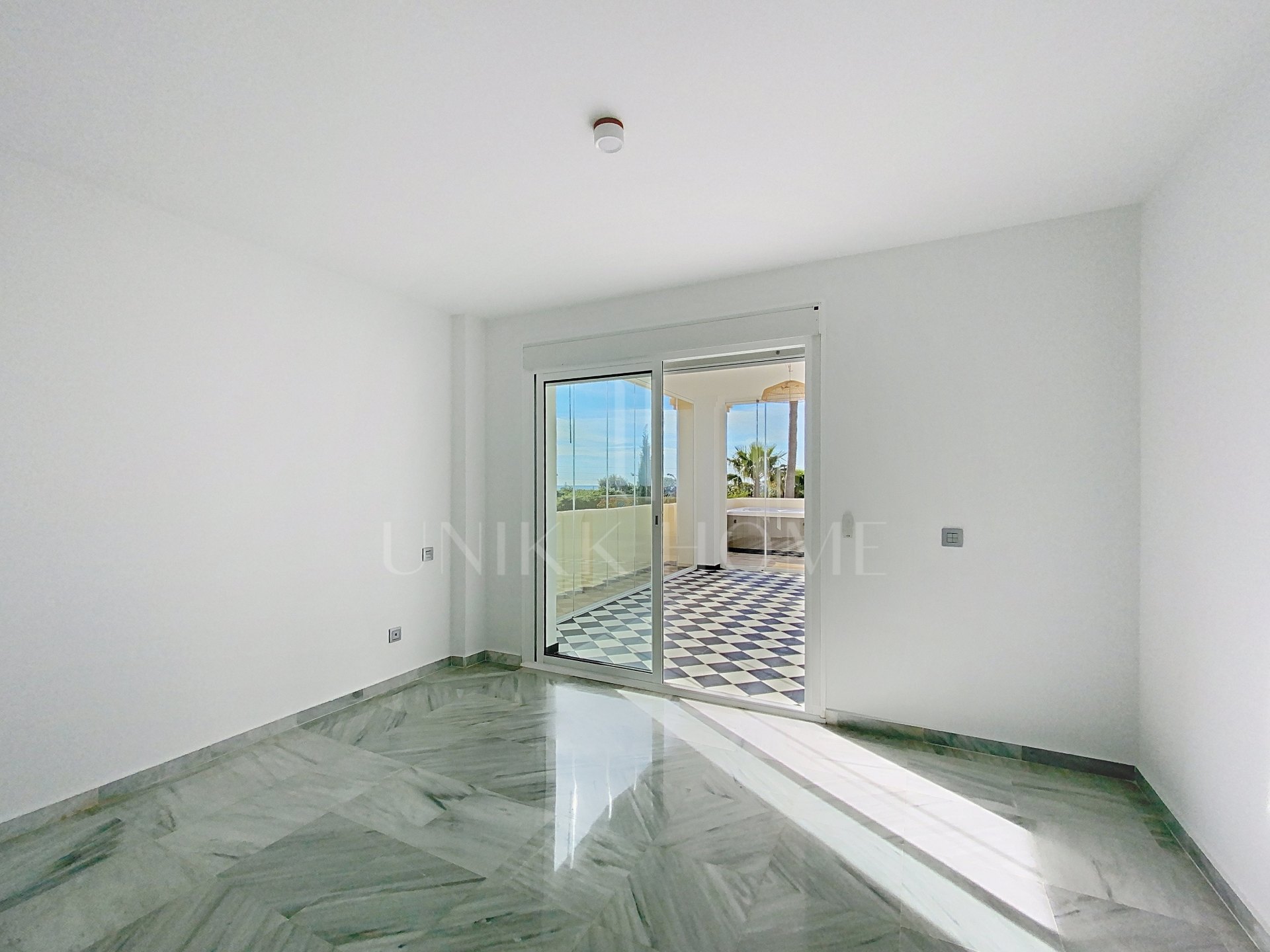 Elevated Ground Floor Sea View Apartment for Sale in Estepona East – Large Terraces & Jacuzzi