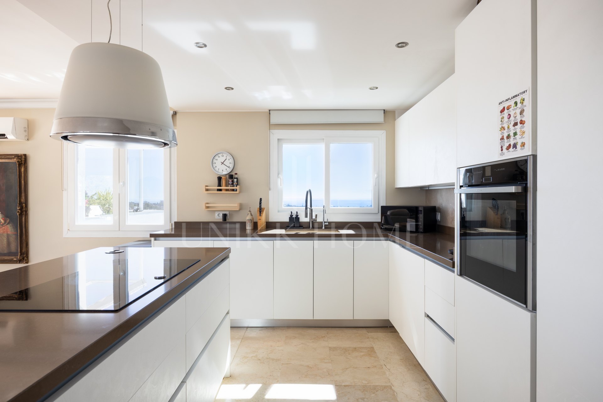 Renovated two-bedroom penthouse in El Paraíso featuring dual terraces, panoramic Mediterranean and La Concha views, luxury finishes, and a prime locations