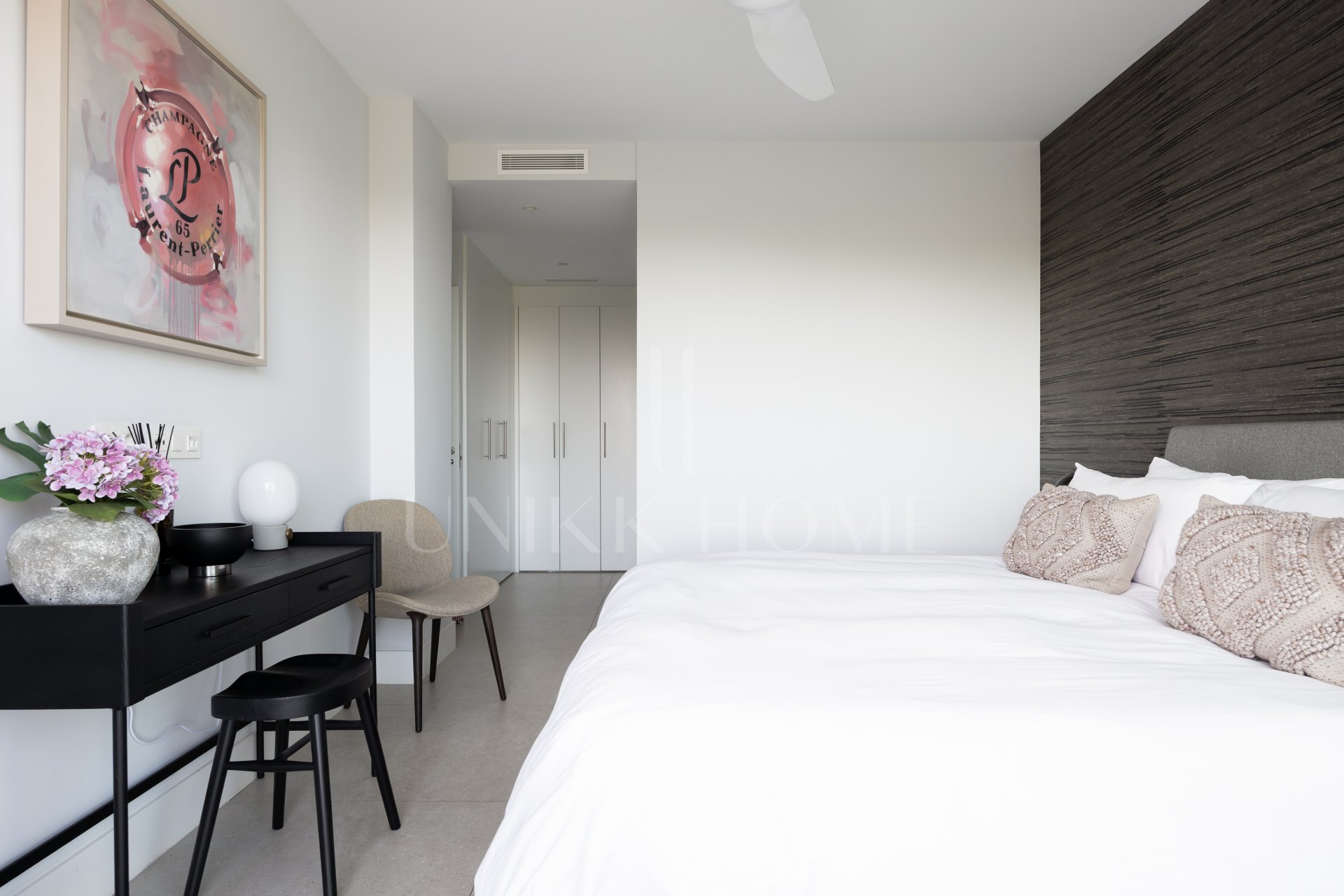 Elegant 2-bed, 2-bath apartment in Marbella’s Golf Valley with 112m² interior, 43m² terrace, luxury finishes, pools, gym, concierge & 2 parking spaces.