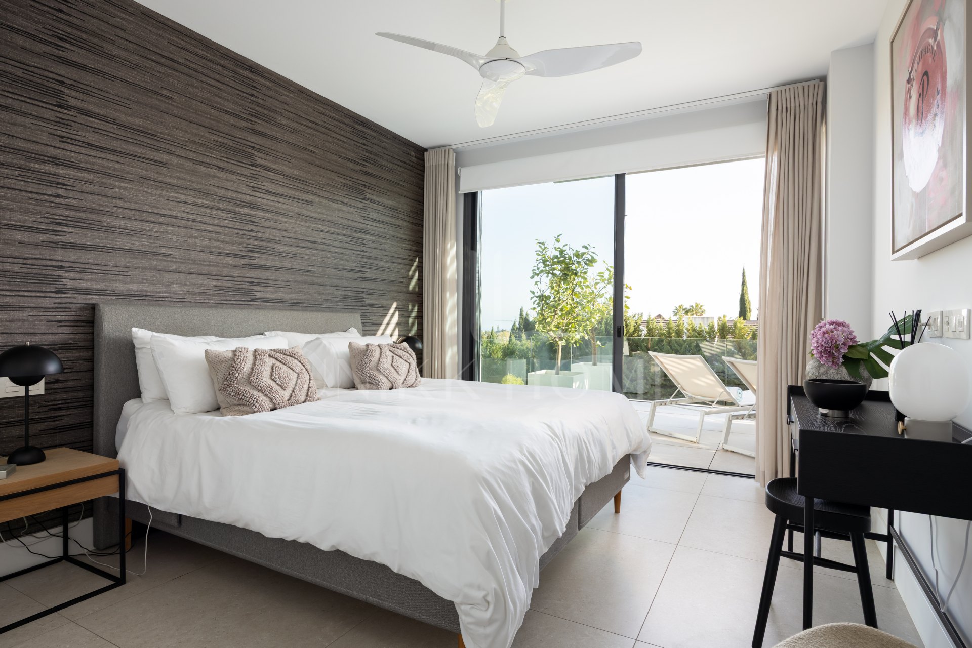 Elegant 2-bed, 2-bath apartment in Marbella’s Golf Valley with 112m² interior, 43m² terrace, luxury finishes, pools, gym, concierge & 2 parking spaces.