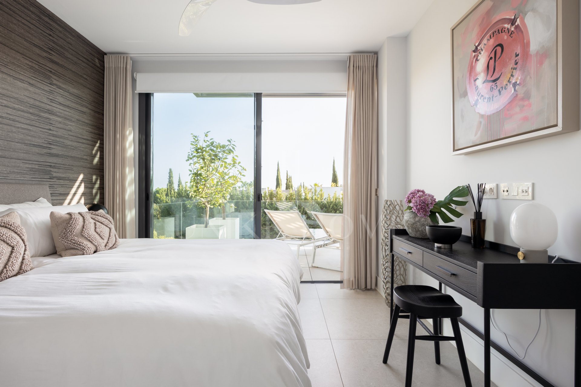 Elegant 2-bed, 2-bath apartment in Marbella’s Golf Valley with 112m² interior, 43m² terrace, luxury finishes, pools, gym, concierge & 2 parking spaces.