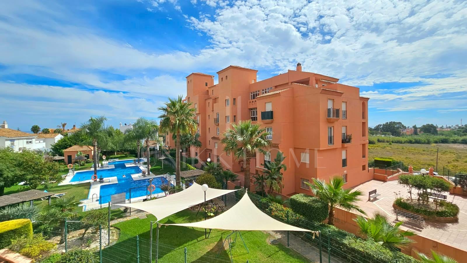 South-facing two-bedroom apartment with pool at Los Hidalgos Golf, Manilva.