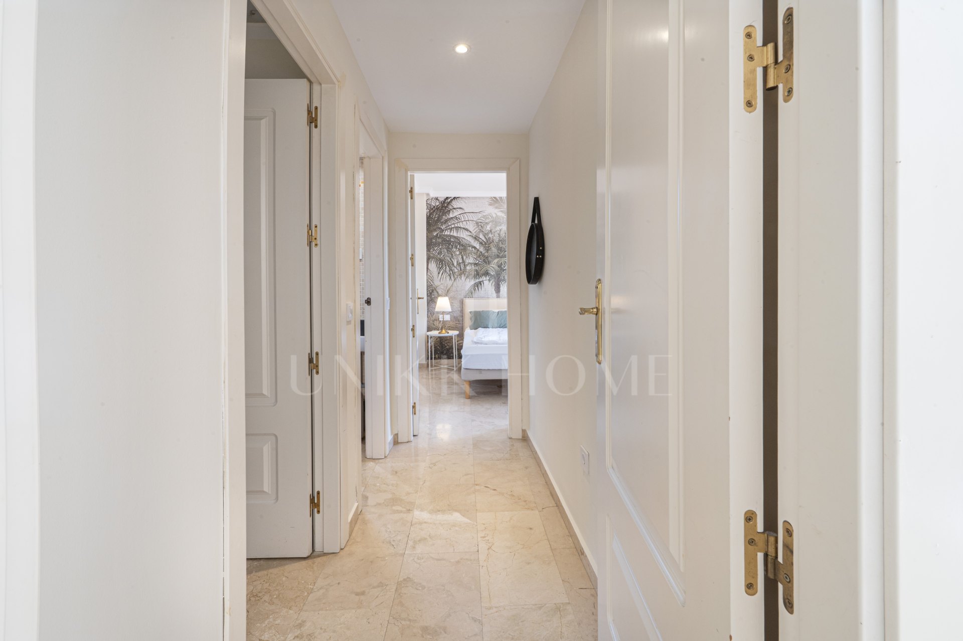 A furnished southwest-facing duplex penthouse in Torrequebrada with panoramic sea and golf views, expansive terraces and two garage parking spaces.