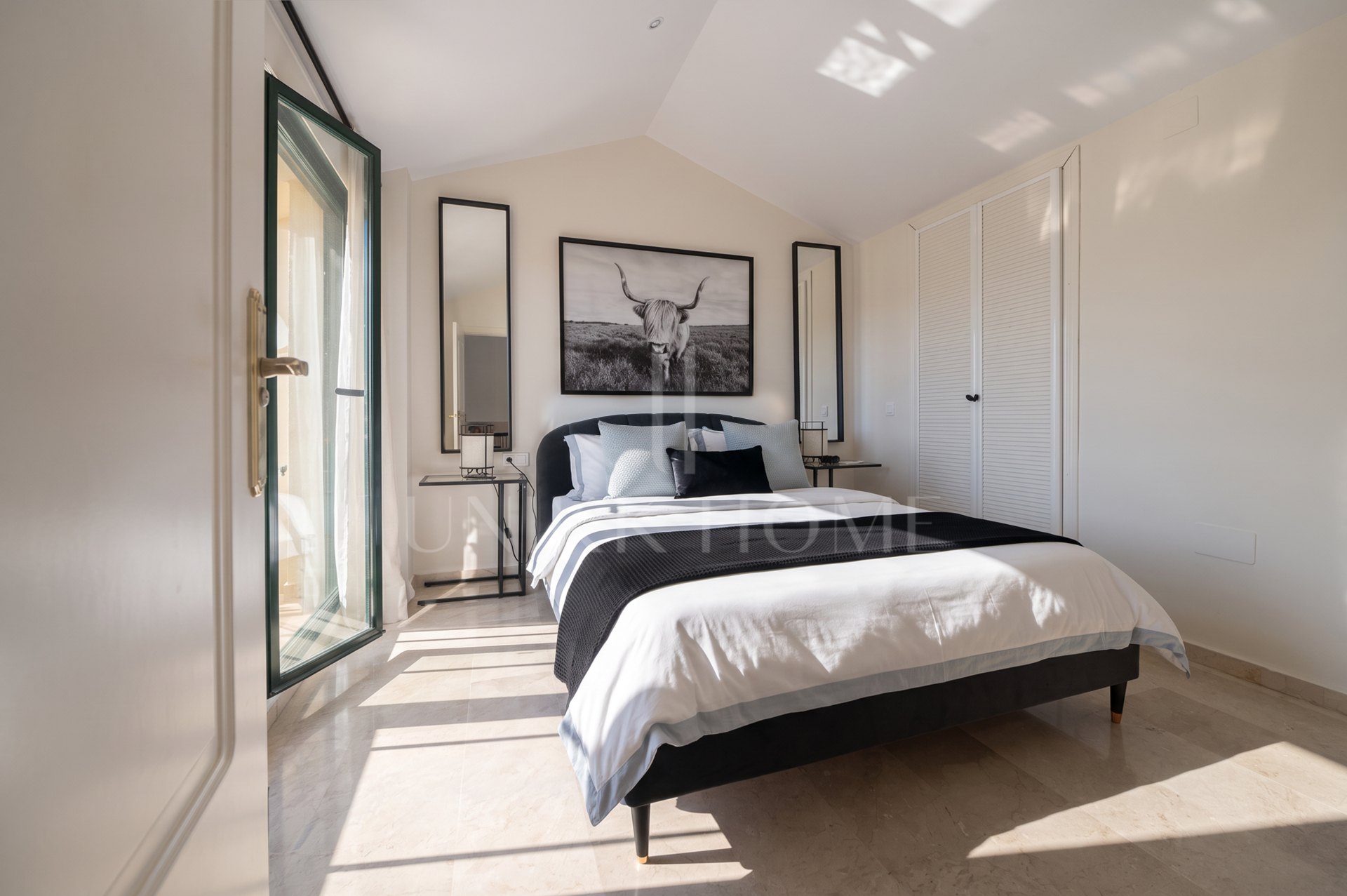 A furnished southwest-facing duplex penthouse in Torrequebrada with panoramic sea and golf views, expansive terraces and two garage parking spaces.