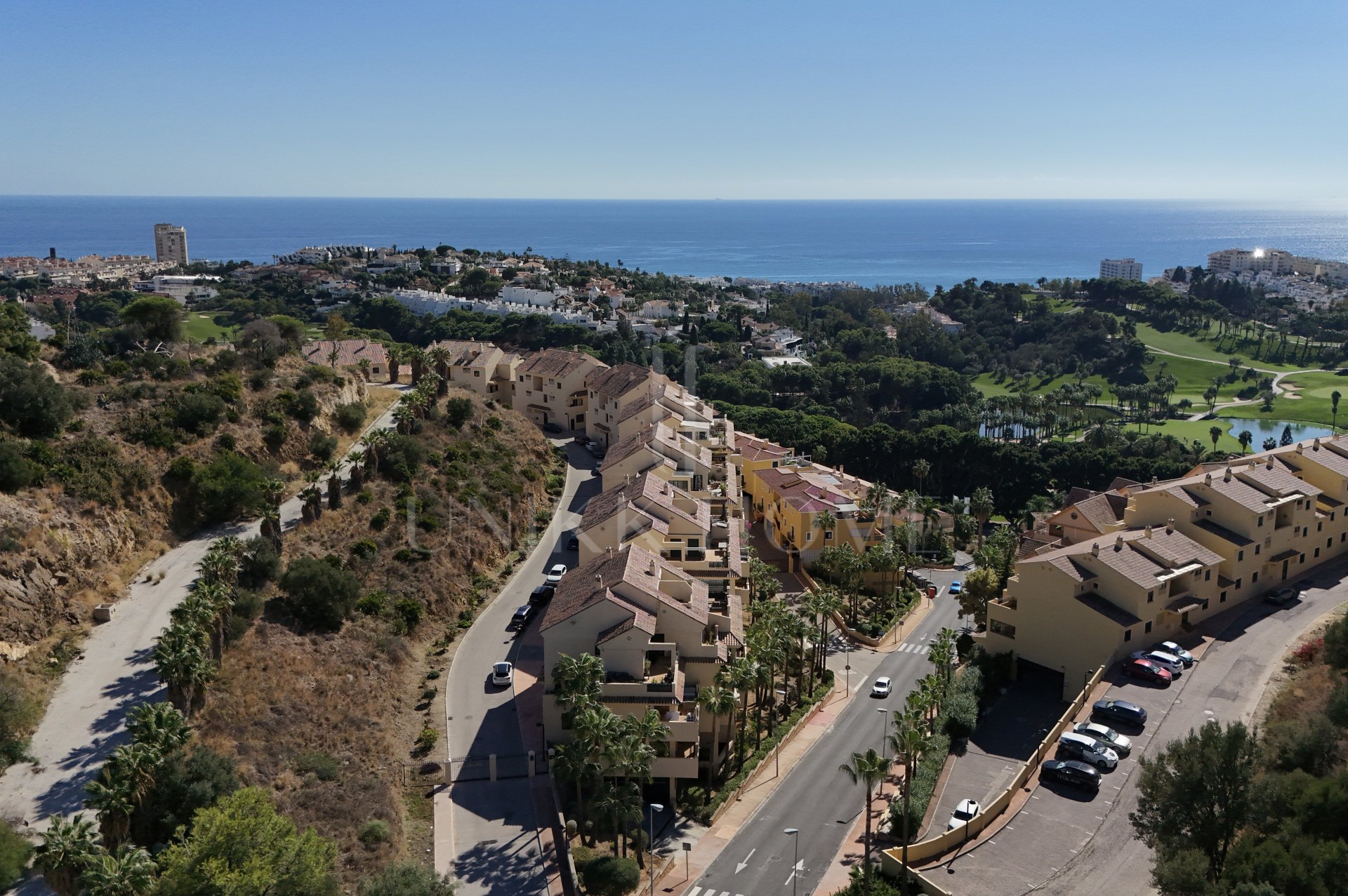 A furnished southwest-facing duplex penthouse in Torrequebrada with panoramic sea and golf views, expansive terraces and two garage parking spaces.