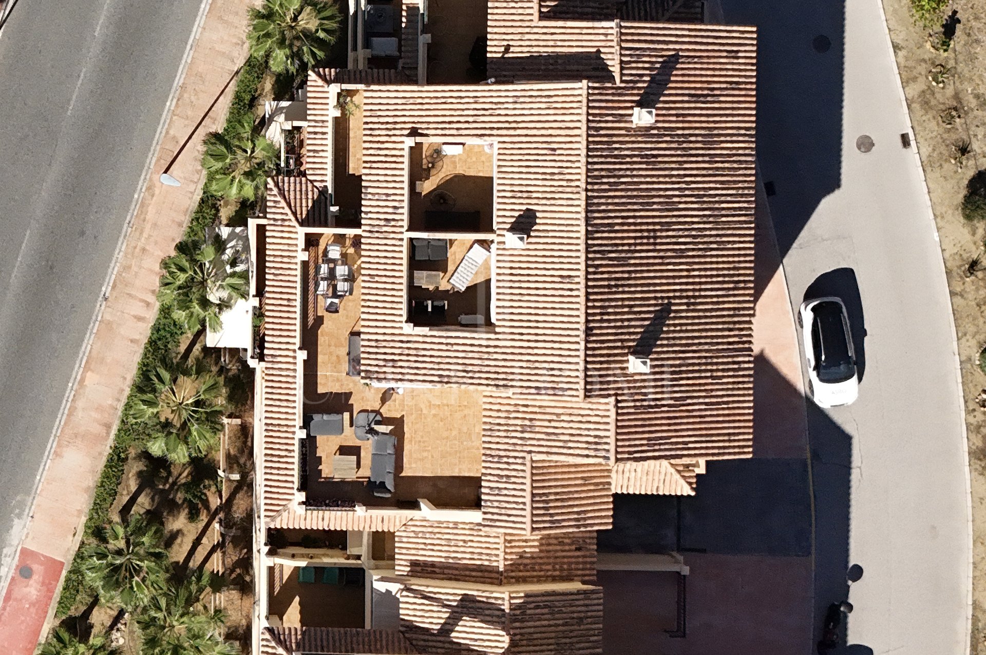 A furnished southwest-facing duplex penthouse in Torrequebrada with panoramic sea and golf views, expansive terraces and two garage parking spaces.