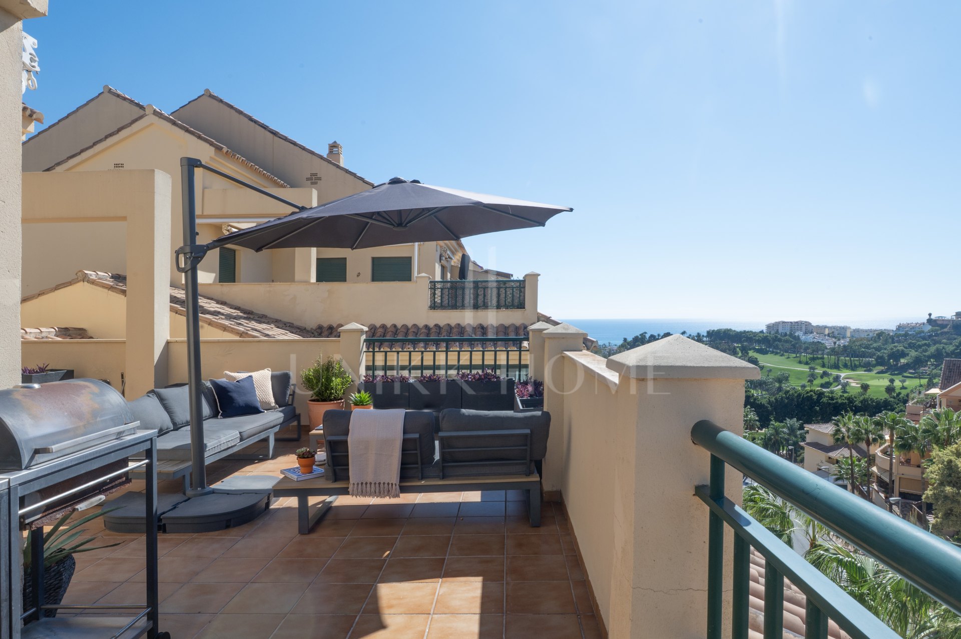 A furnished southwest-facing duplex penthouse in Torrequebrada with panoramic sea and golf views, expansive terraces and two garage parking spaces.