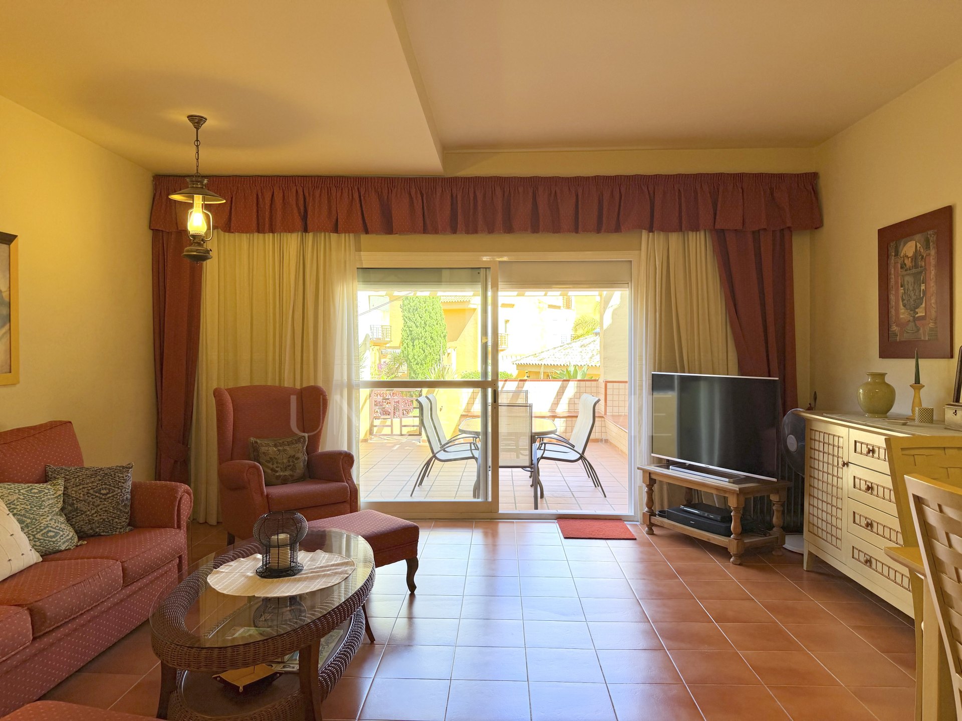 Town house in Cancelada, Estepona East with sea and mountain views, private garden, roof terrace, communal pool and garage for two cars.