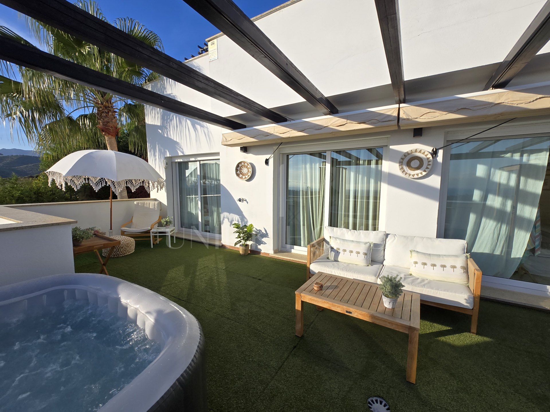 Exclusive Townhouse with panoramic sea, mountain, and golf course views, located in the highly sought-after Santa Clara Golf urbanisation.