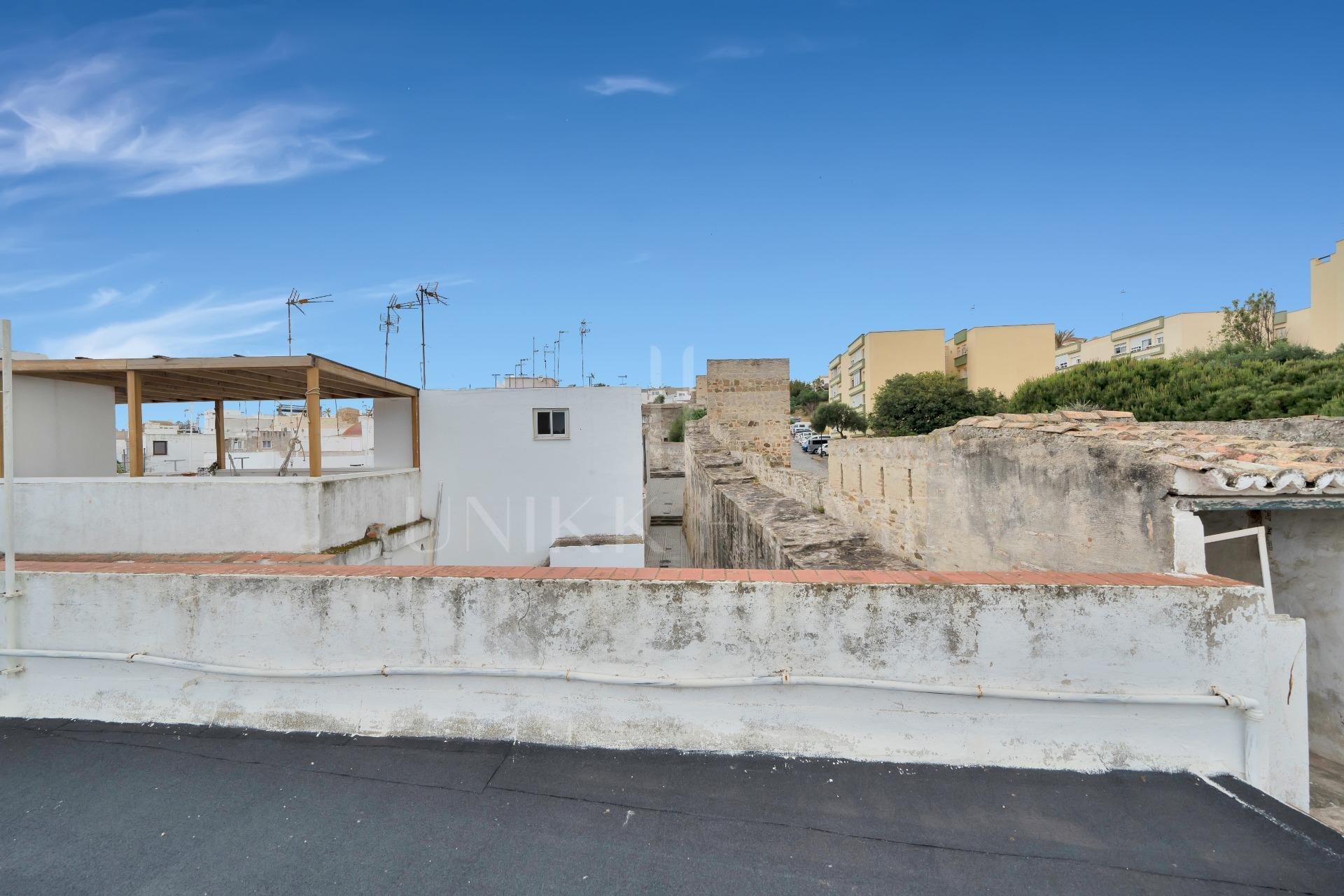 HOUSE IN THE HISTORIC CENTER OF TARIFA ON THE MEDIEVAL WALL.