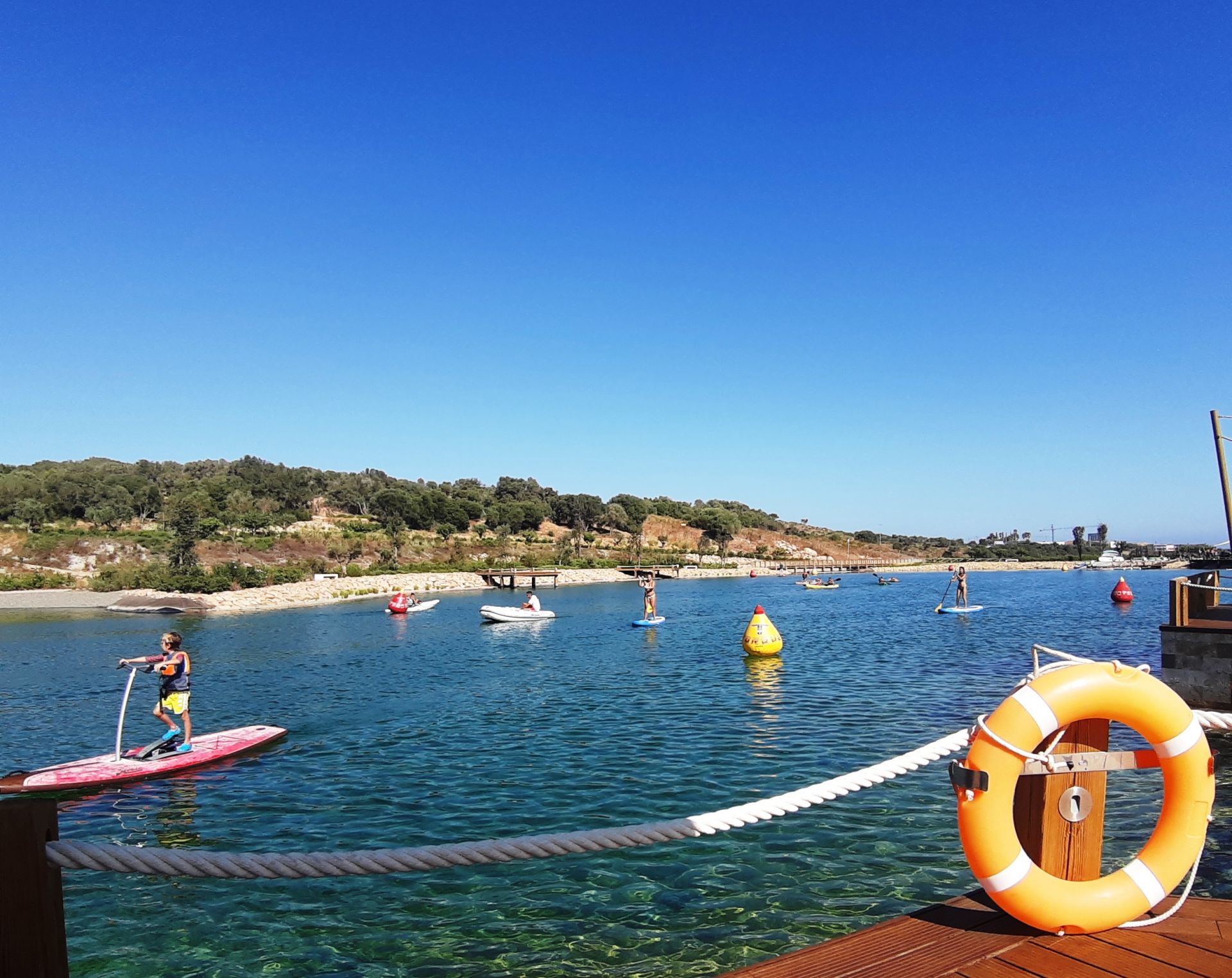 Kids practising paddle surfing in Sotogrande