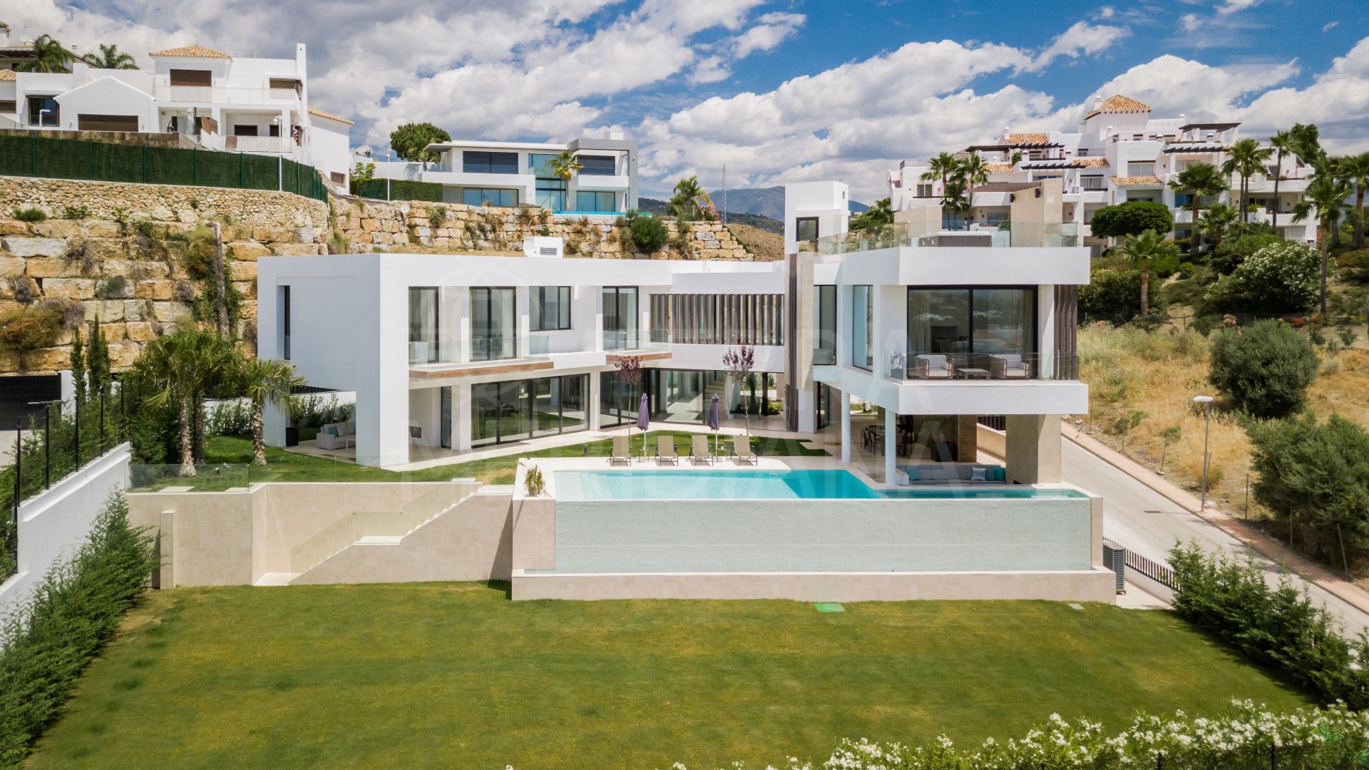 One-of-a-kind contemporary luxury villa with golf and sea vistas for sale in prime La Alqueria, Benahavis