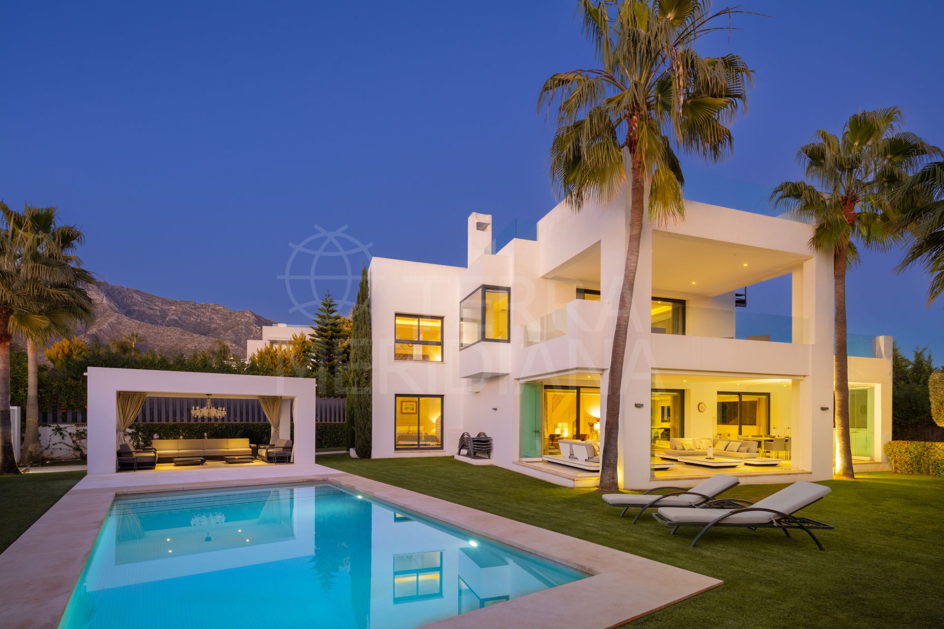 A light filled villa with contemporary interiors for sale in Altos de Puente Romano, Marbella Golden Mile