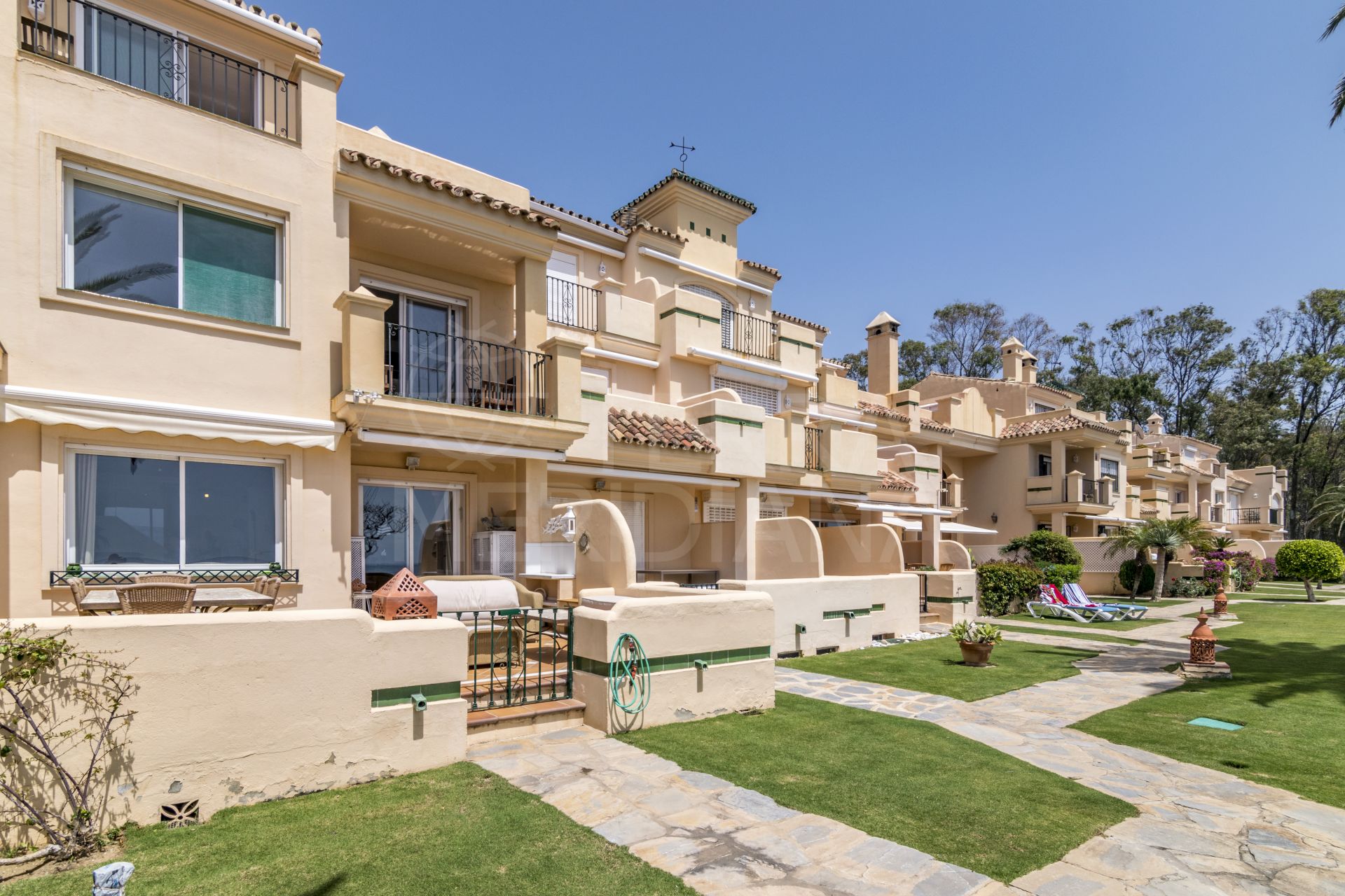 Ideally located beachfront townhouse with stunning views for sale in Lun y May, New Golden Mile, Estepona