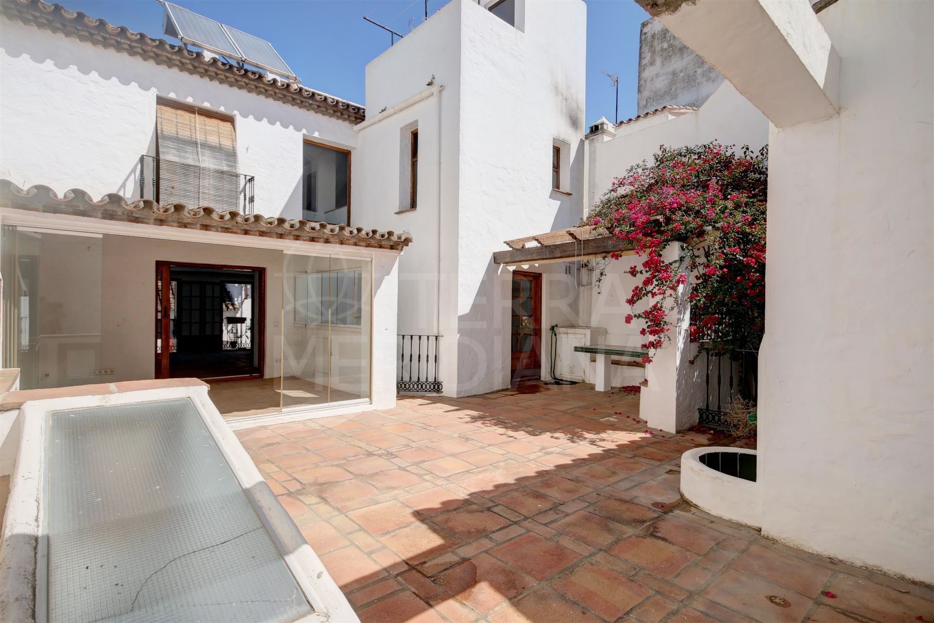 Very large townhouse for sale with unique patio in the old town centre of Estepona