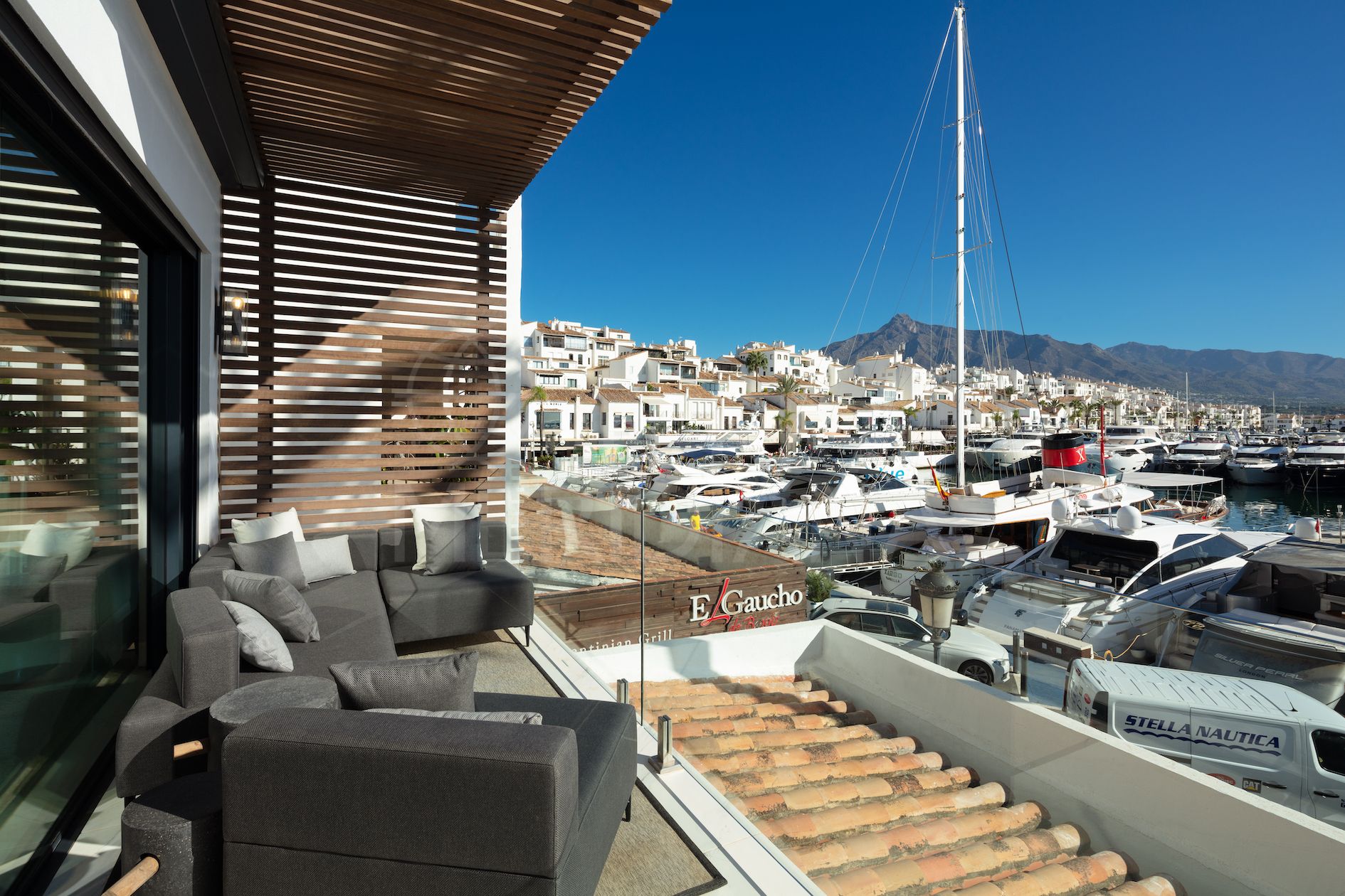 Breathtaking upgraded apartment with post-card perfect views for sale in Puerto Banus, Marbella