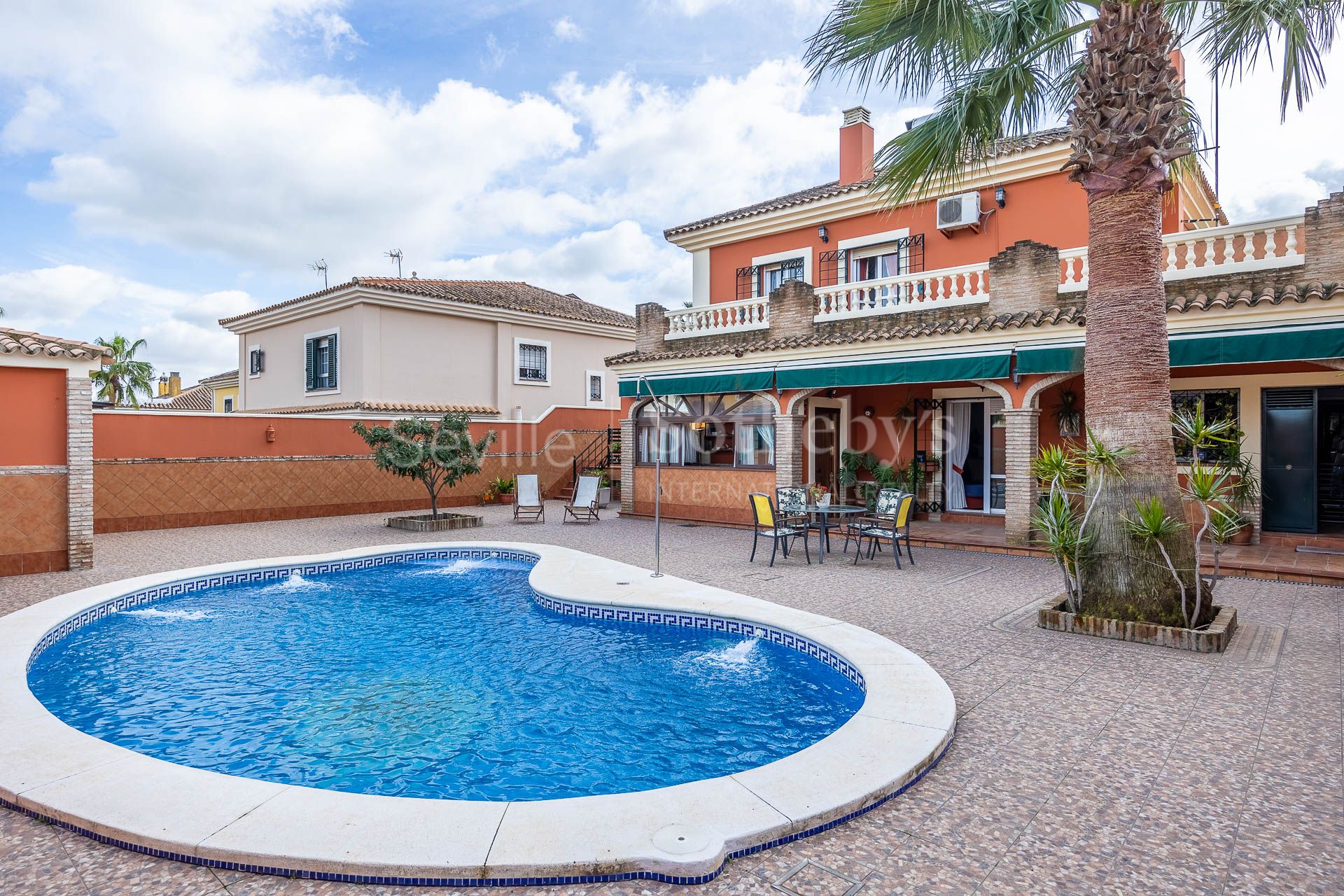 Two-story detached house with pool.