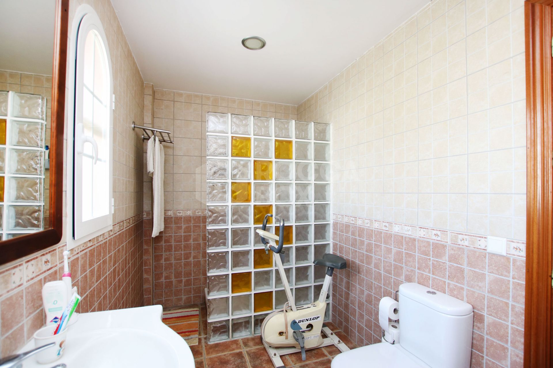 An impressive villa is for sale just a 5-minute drive from the beautiful Los Boliches beach, Mijas Costa.