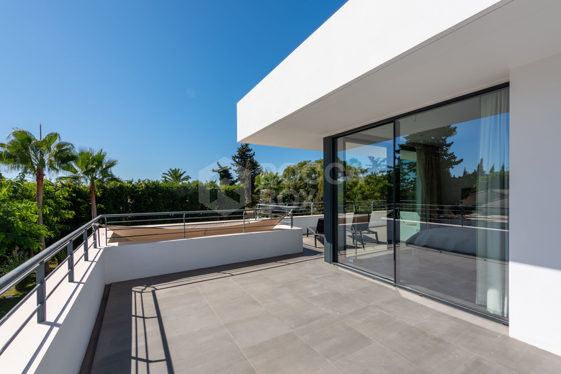 This contemporary four-bedroom detached villa, located in Atalaya Isdabe, is a perfect blend of comfort and luxury