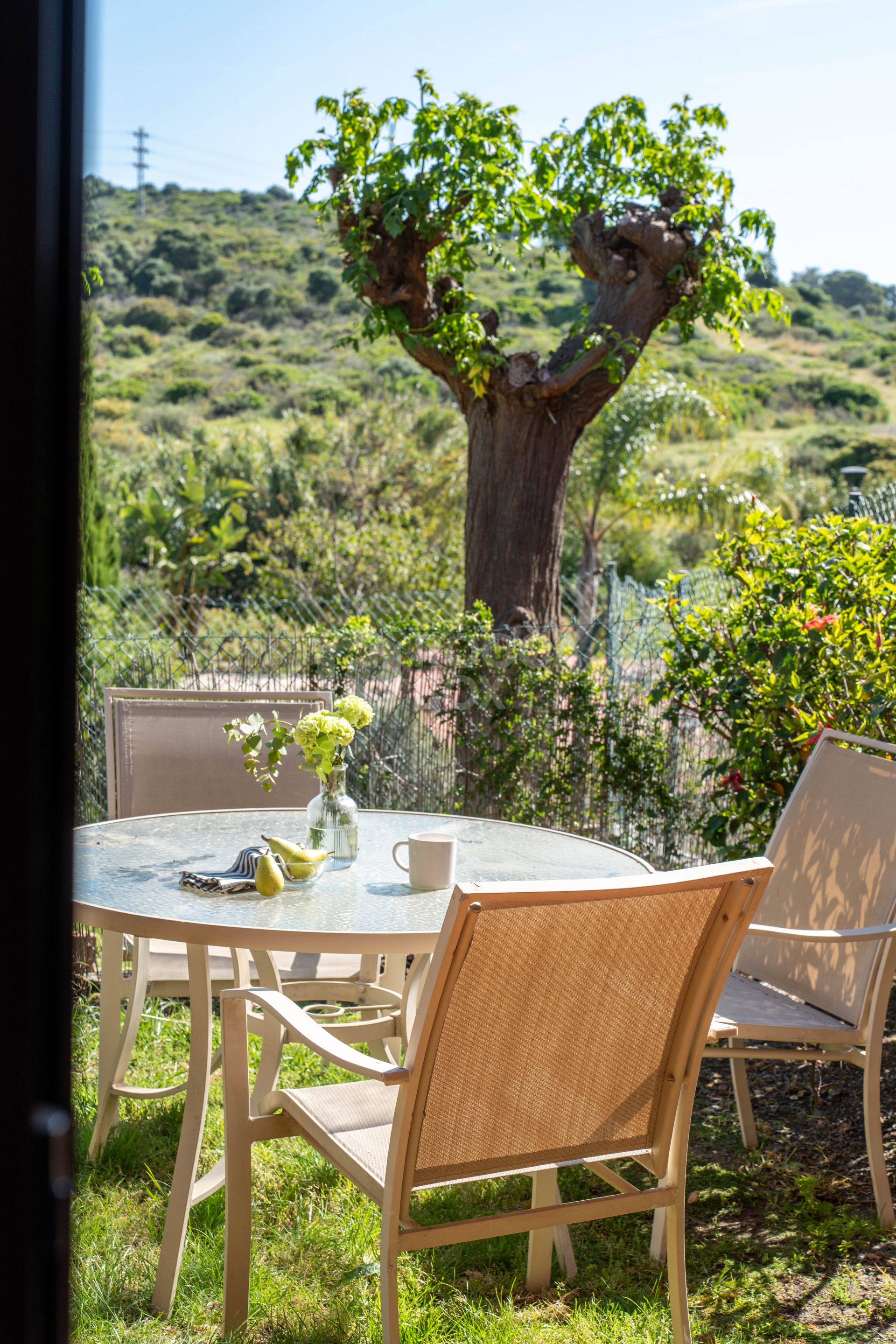 Elegant Coastal Living in Estepona – Corner Garden Apartment with Style & Serenity in Costa Galera