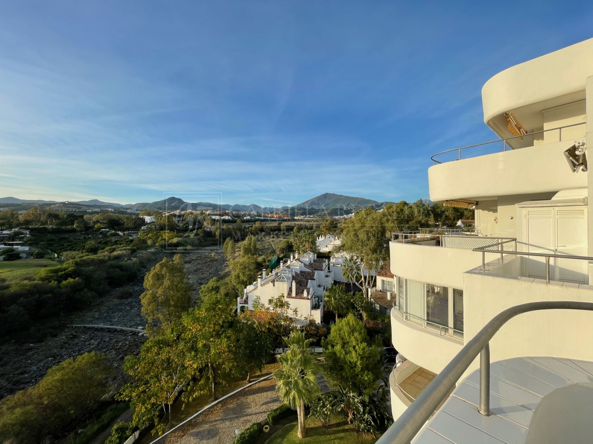 Bright apartment with open golf and sea views.
