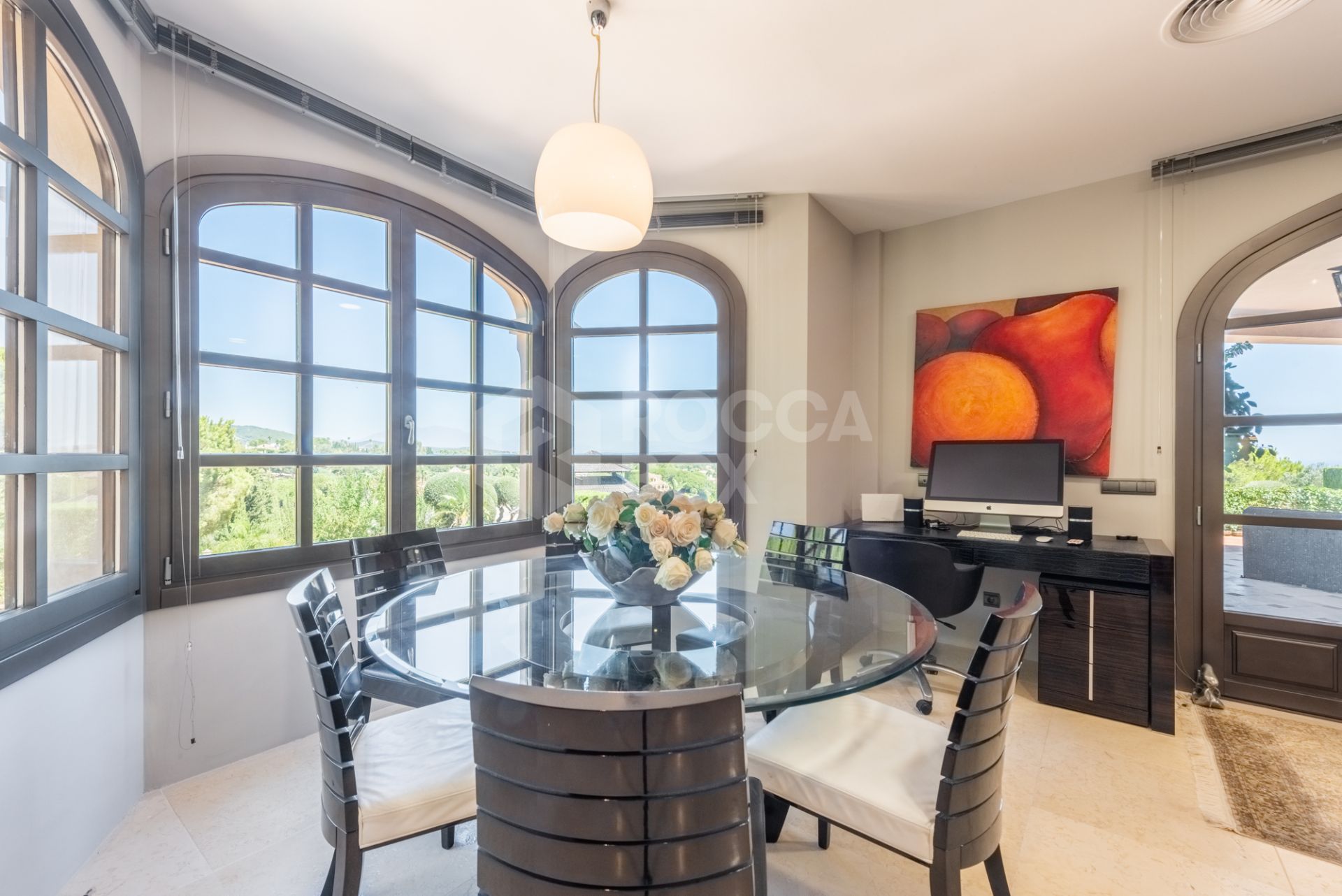 A superb villa built on an elevated site with outstanding panoramic views over golf courses to mountains and the sea.