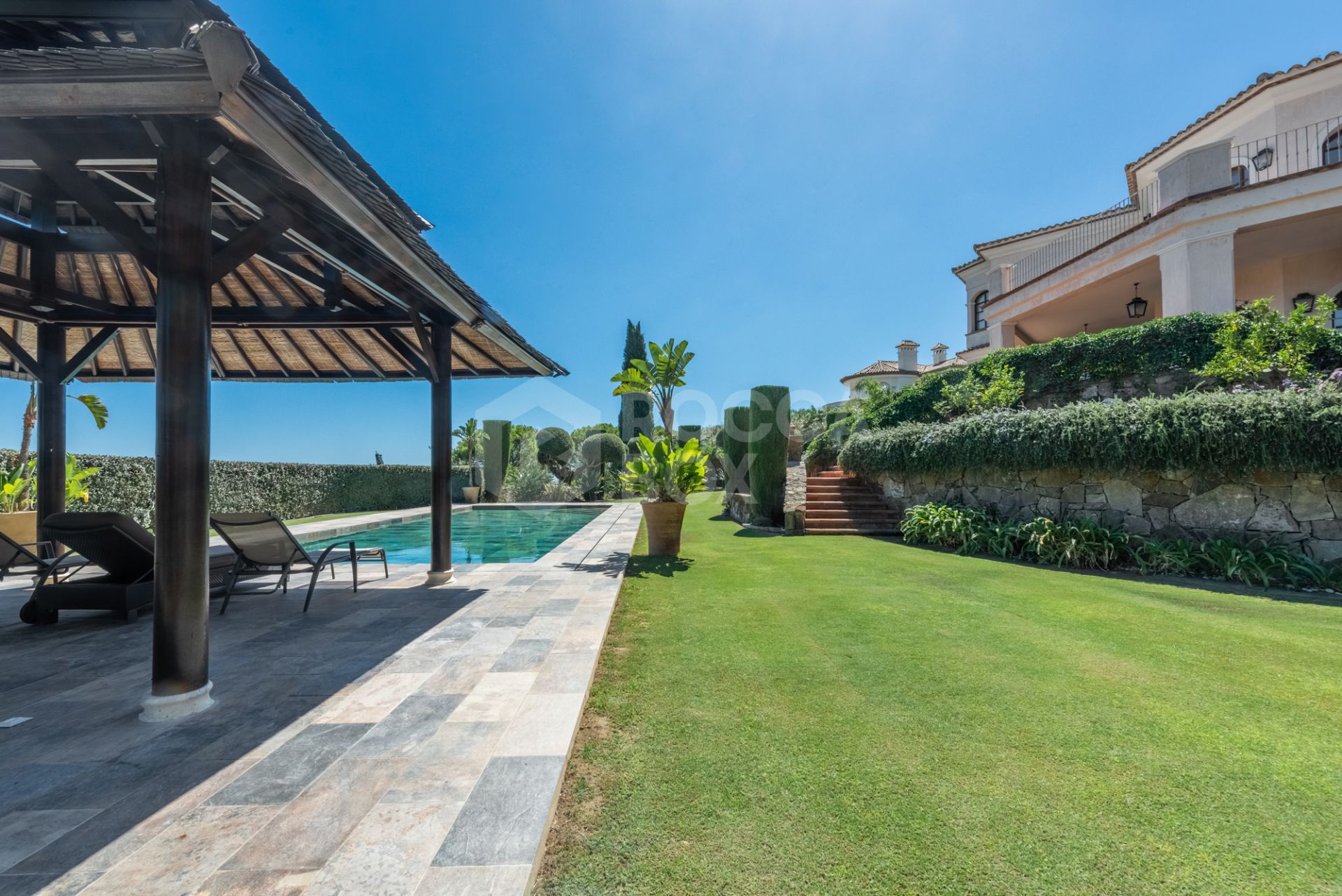 A superb villa built on an elevated site with outstanding panoramic views over golf courses to mountains and the sea.