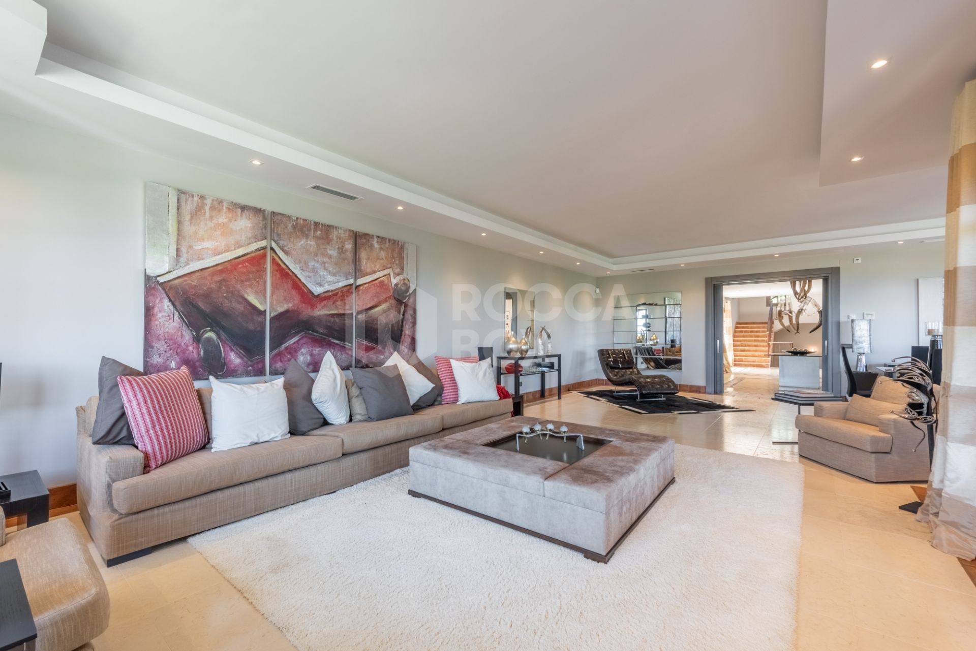 A superb villa built on an elevated site with outstanding panoramic views over golf courses to mountains and the sea.