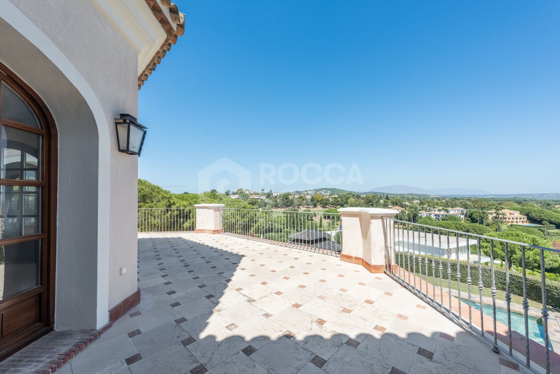 A superb villa built on an elevated site with outstanding panoramic views over golf courses to mountains and the sea.