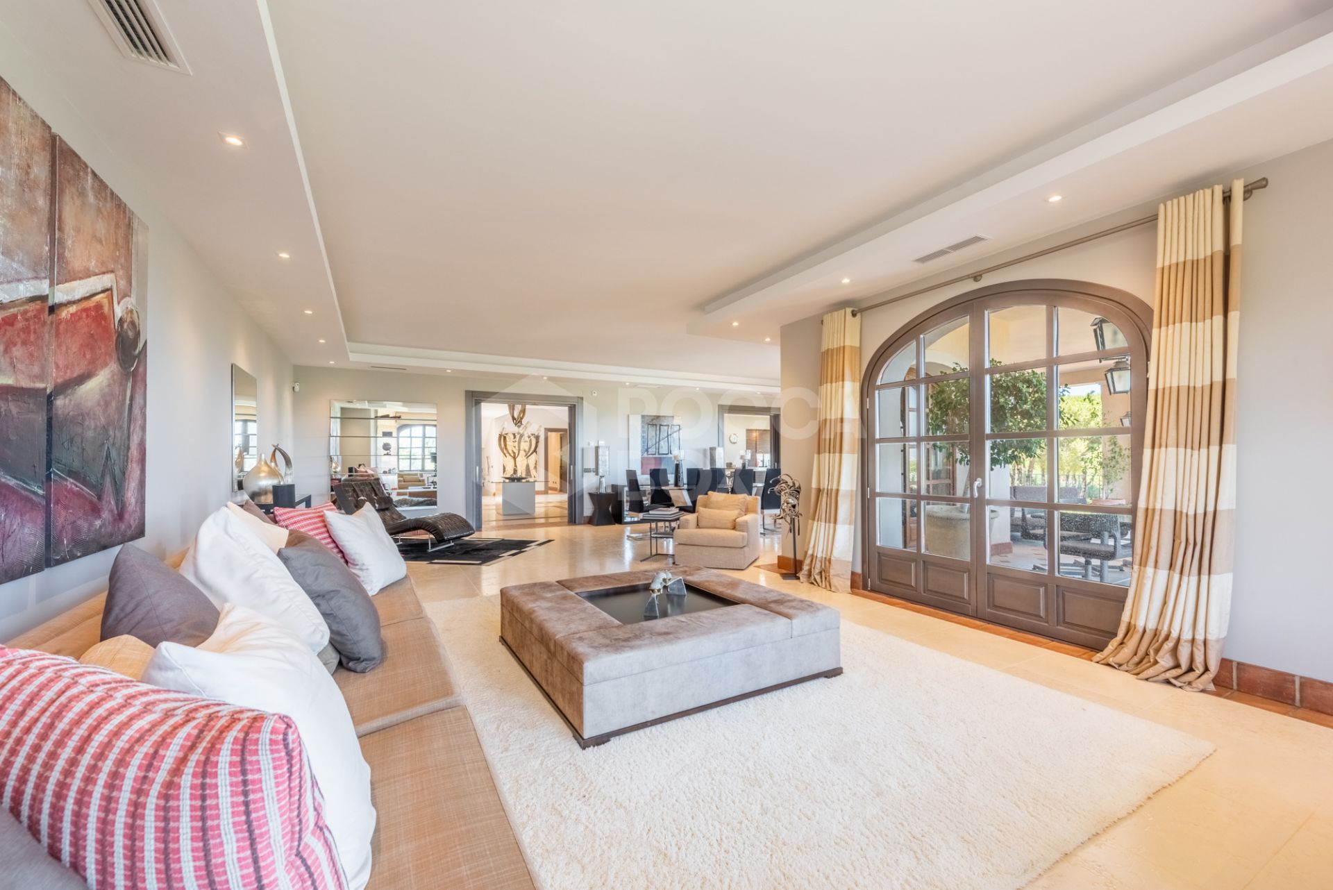 A superb villa built on an elevated site with outstanding panoramic views over golf courses to mountains and the sea.