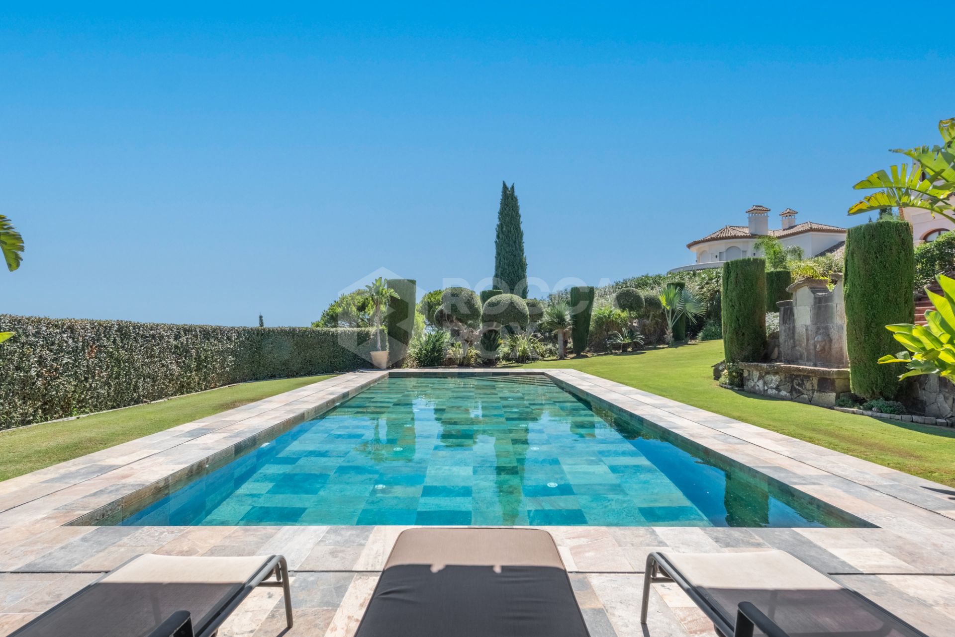 A superb villa built on an elevated site with outstanding panoramic views over golf courses to mountains and the sea.