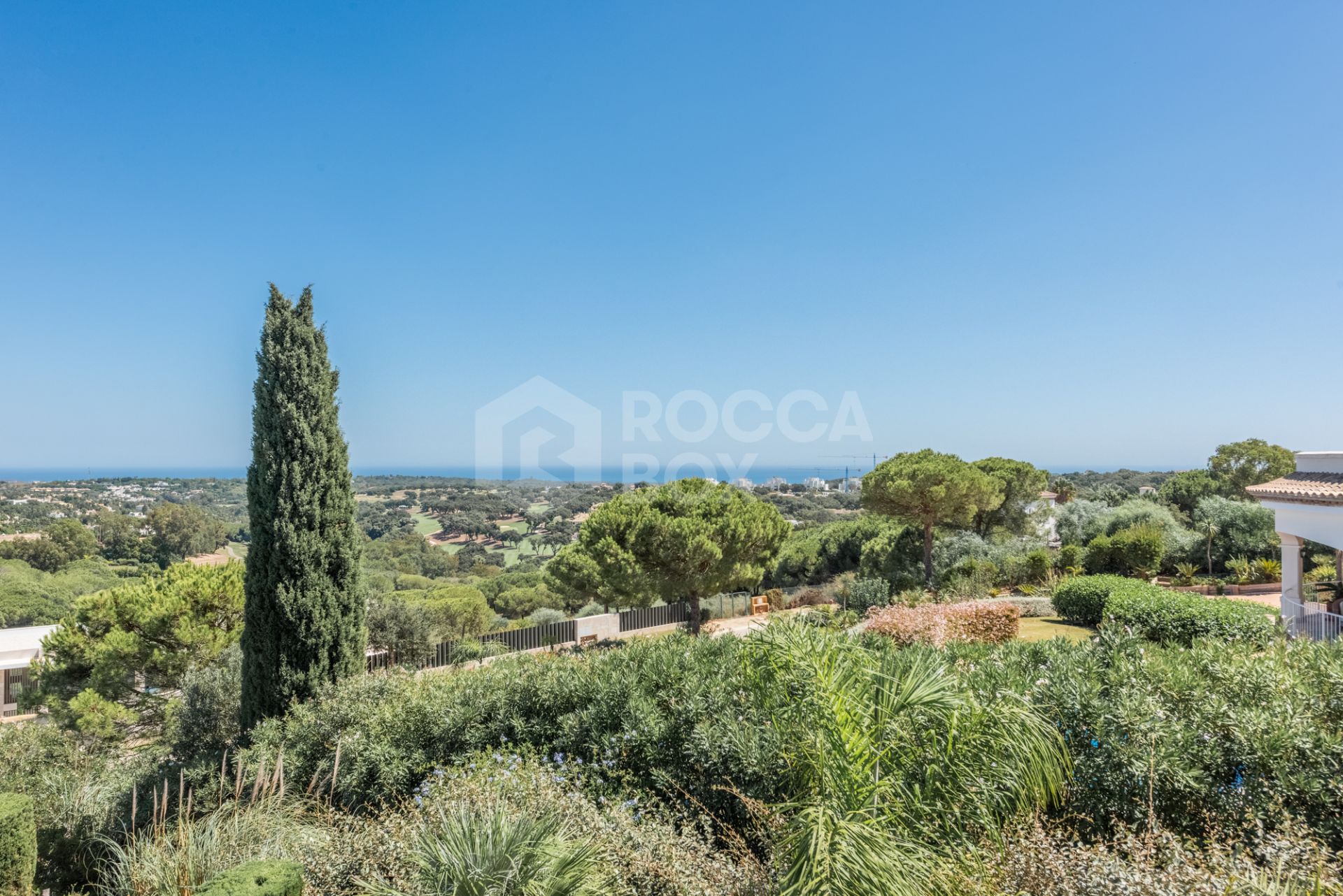 A superb villa built on an elevated site with outstanding panoramic views over golf courses to mountains and the sea.