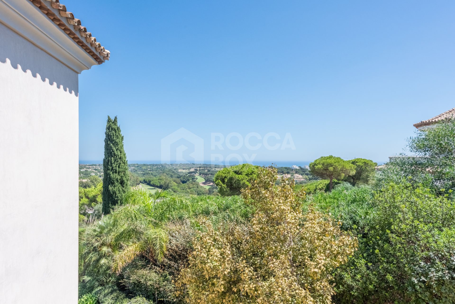 A superb villa built on an elevated site with outstanding panoramic views over golf courses to mountains and the sea.