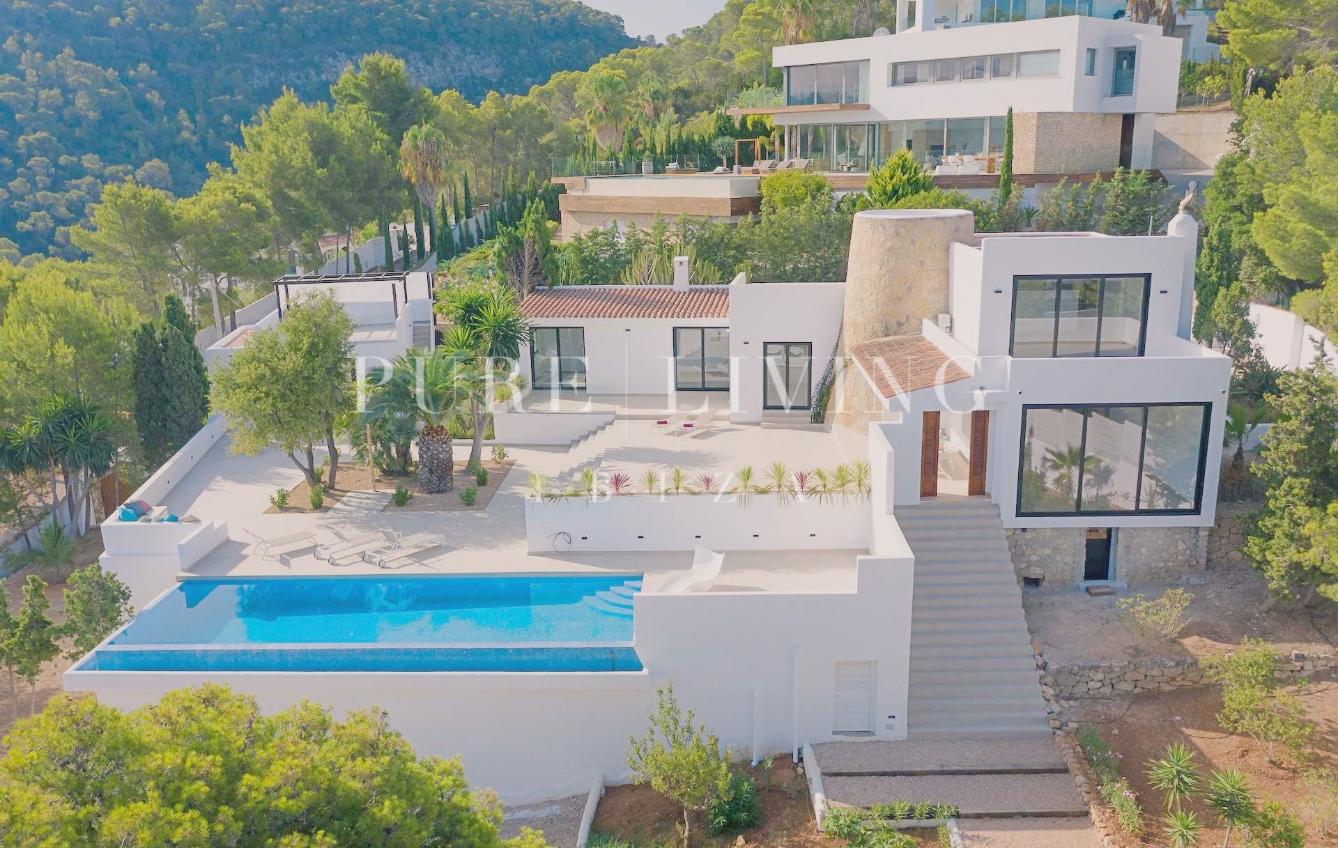 Elegantly renovated villa in Cala Moli, San José, offering sea views and modern luxury in a private and tranquil setting.