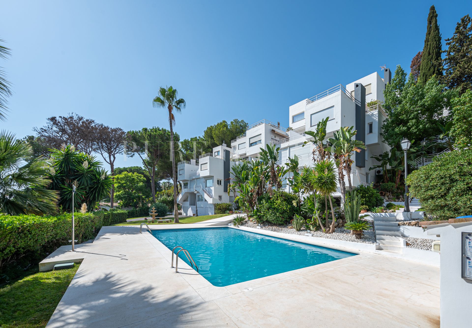 Contemporary style townhouse in Nueva Andalucia with three bedrooms and panoramic sea and mountain views.