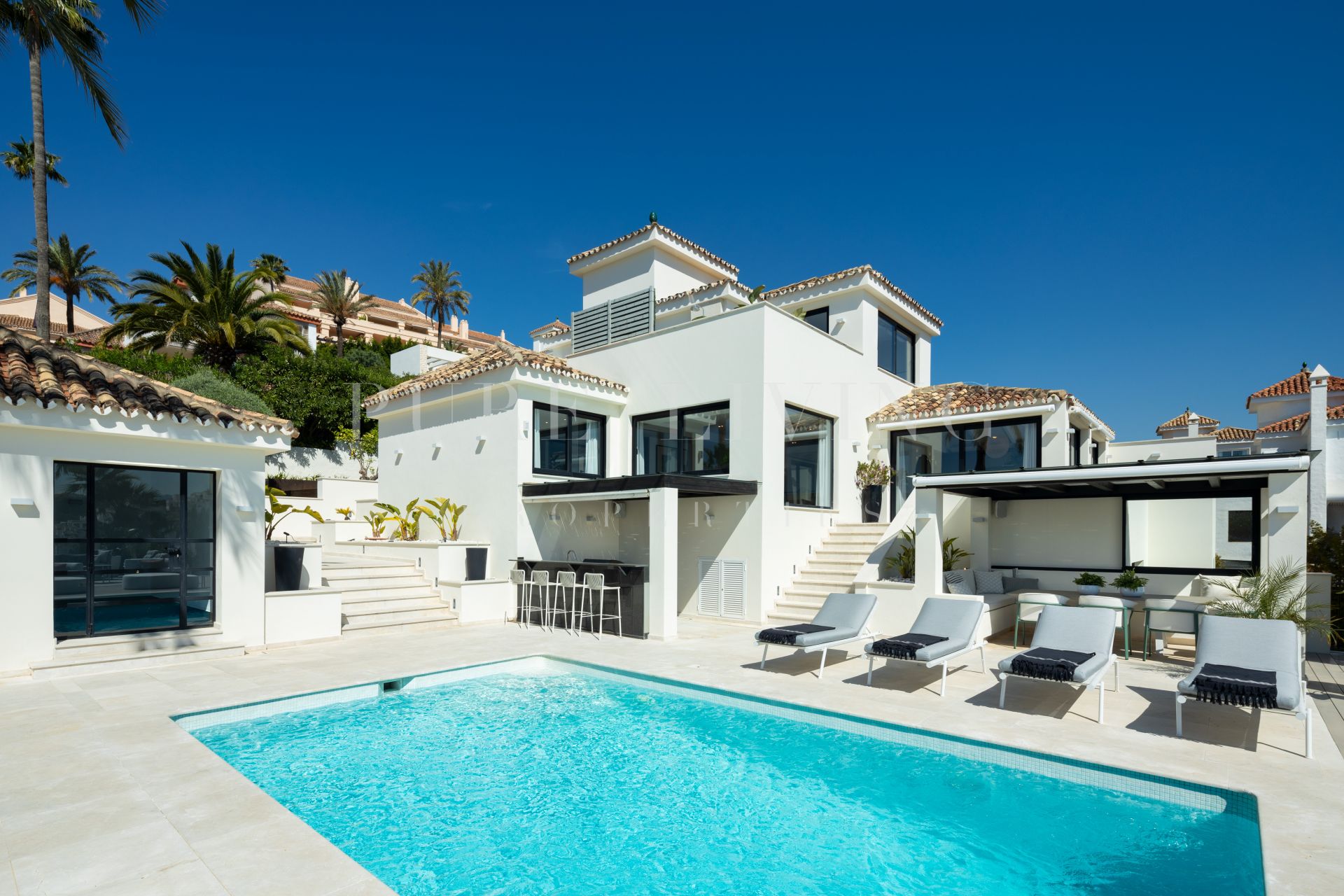 A stunning recently renovated villa located in the exclusive Los Naranjos Hill Club