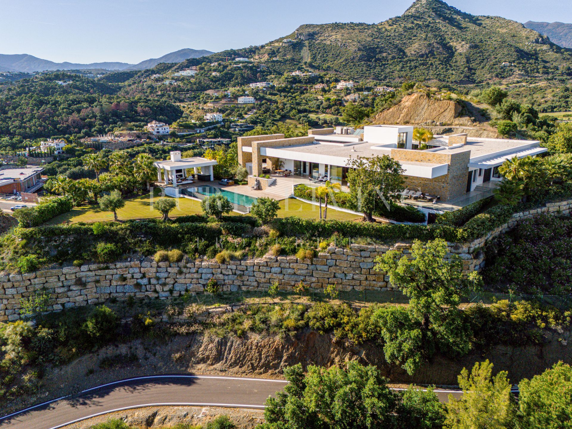 Unique and utterly sublime, this mansion sits atop its hillside overlooking Mediterranean coastline.