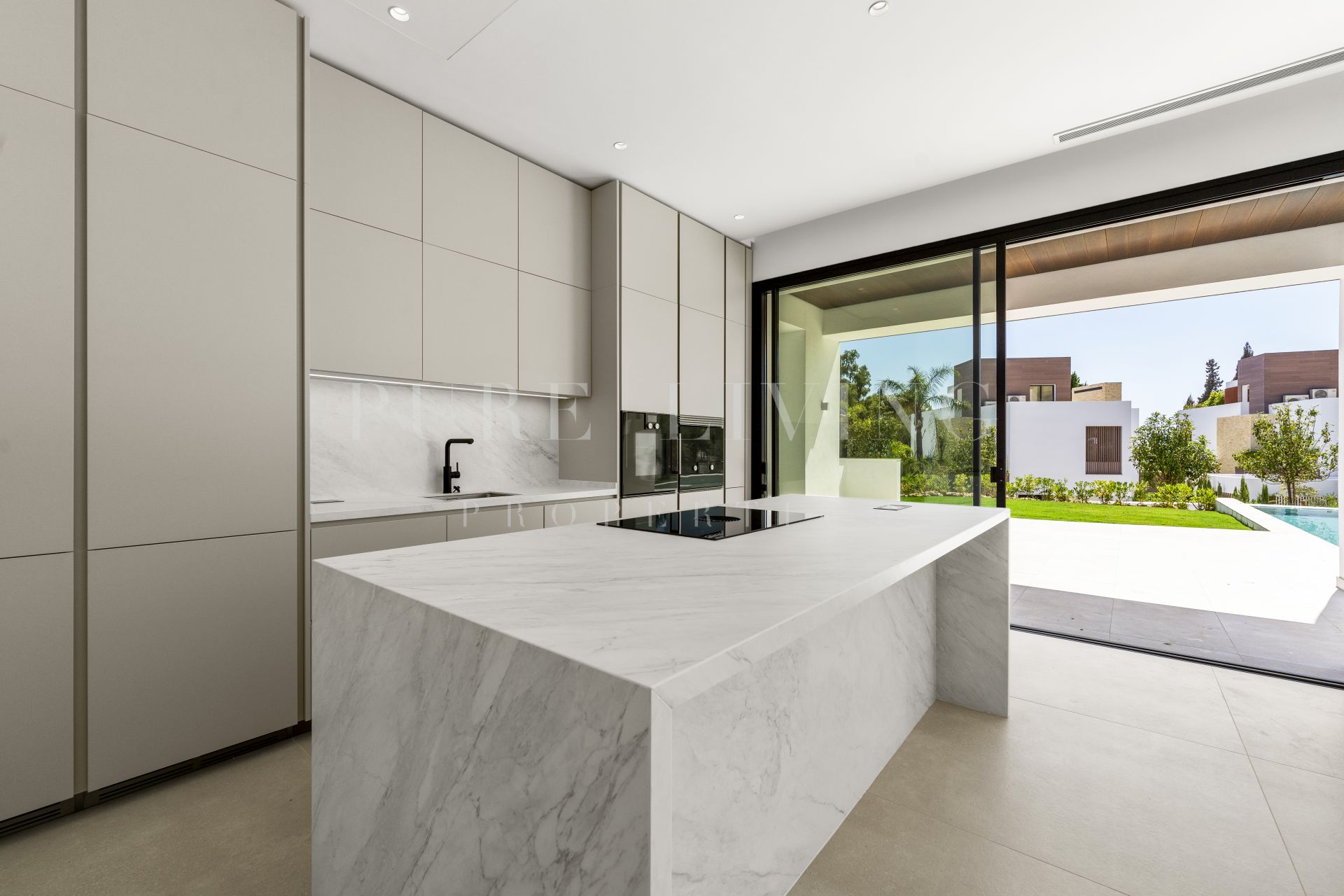 A modern four bedroom villa is nestled within a luxury gated community in Marbella.