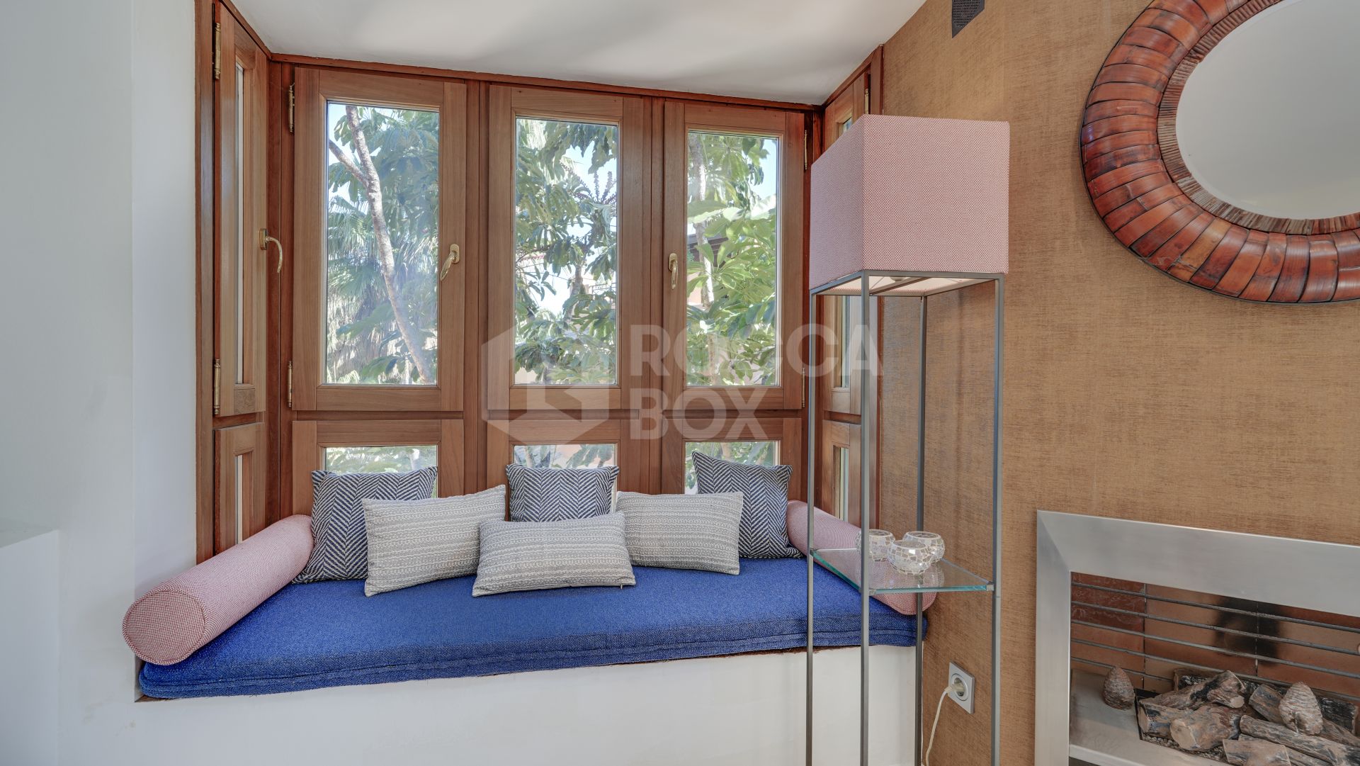 Mediterranean-style duplex penthouse with multiple terraces and a rooftop terrace with a private sauna and barbecue area