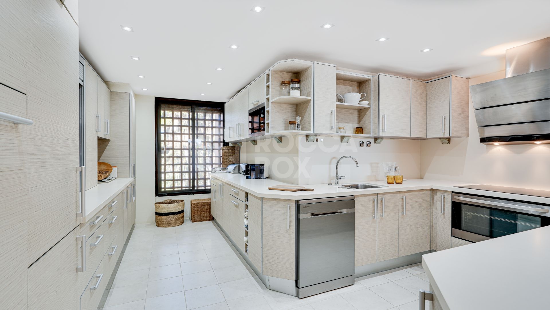 Mediterranean-style duplex penthouse with multiple terraces and a rooftop terrace with a private sauna and barbecue area