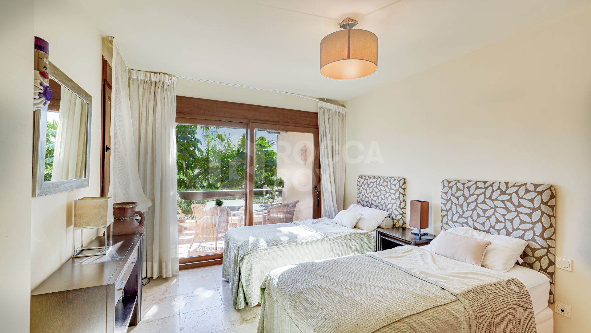 Mediterranean-style duplex penthouse with multiple terraces and a rooftop terrace with a private sauna and barbecue area