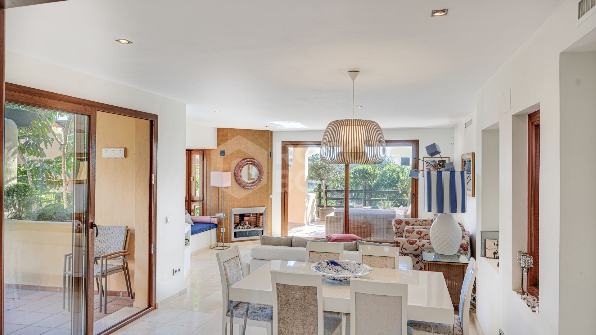 Mediterranean-style duplex penthouse with multiple terraces and a rooftop terrace with a private sauna and barbecue area