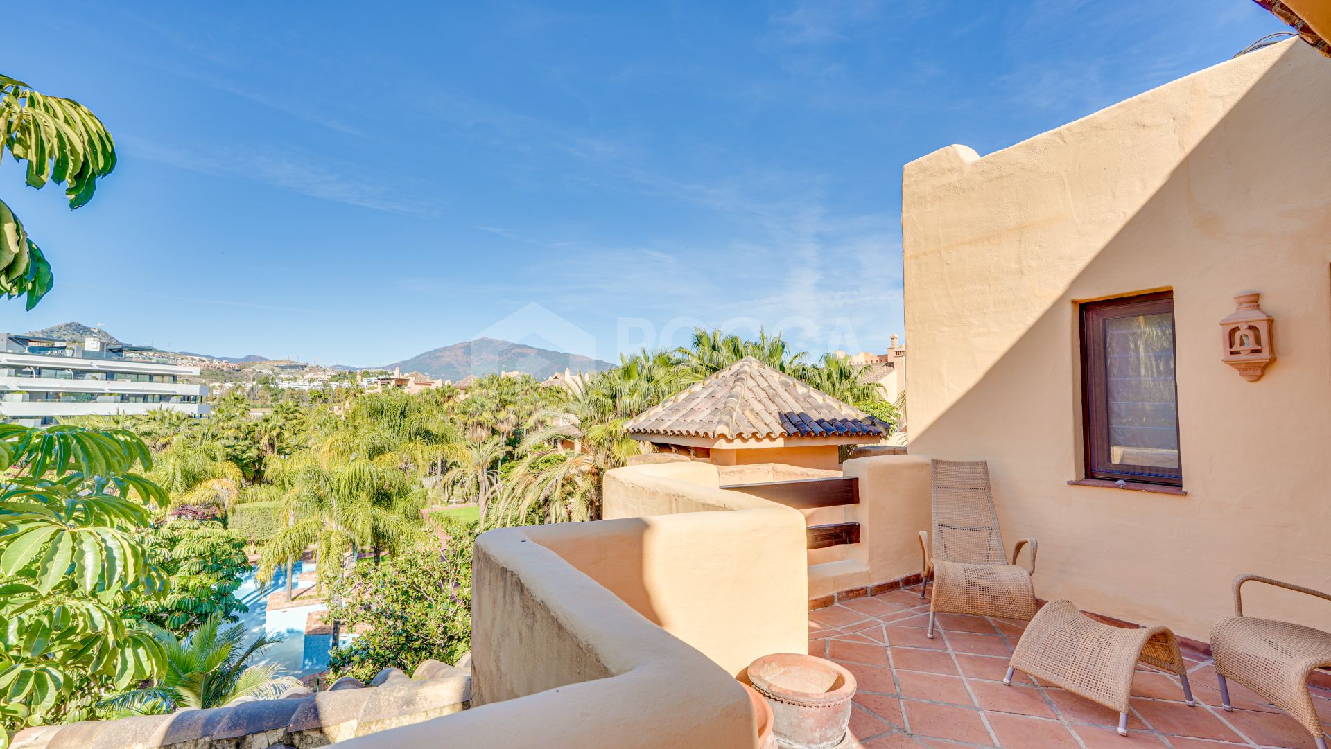 Mediterranean-style duplex penthouse with multiple terraces and a rooftop terrace with a private sauna and barbecue area