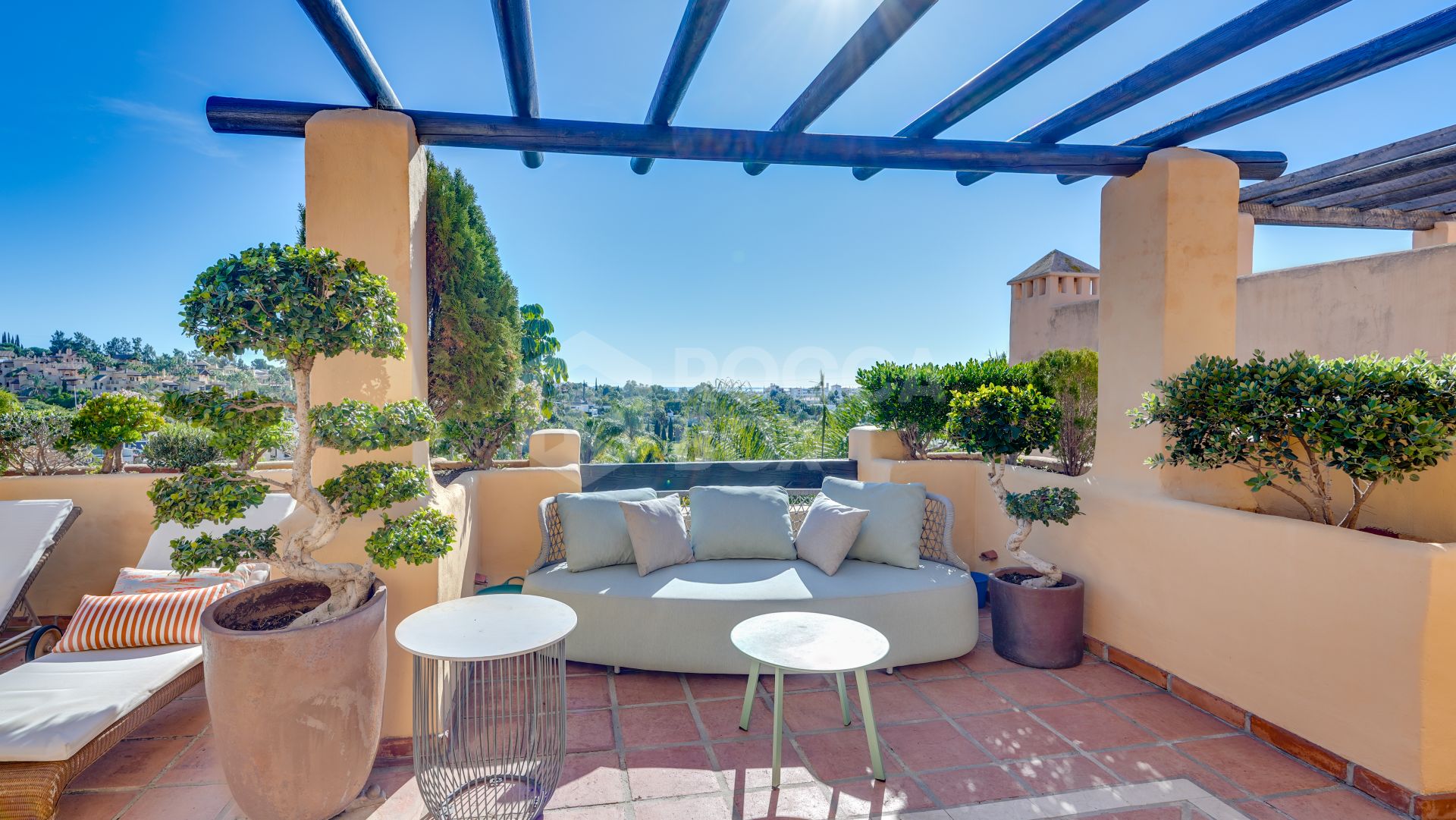 Mediterranean-style duplex penthouse with multiple terraces and a rooftop terrace with a private sauna and barbecue area