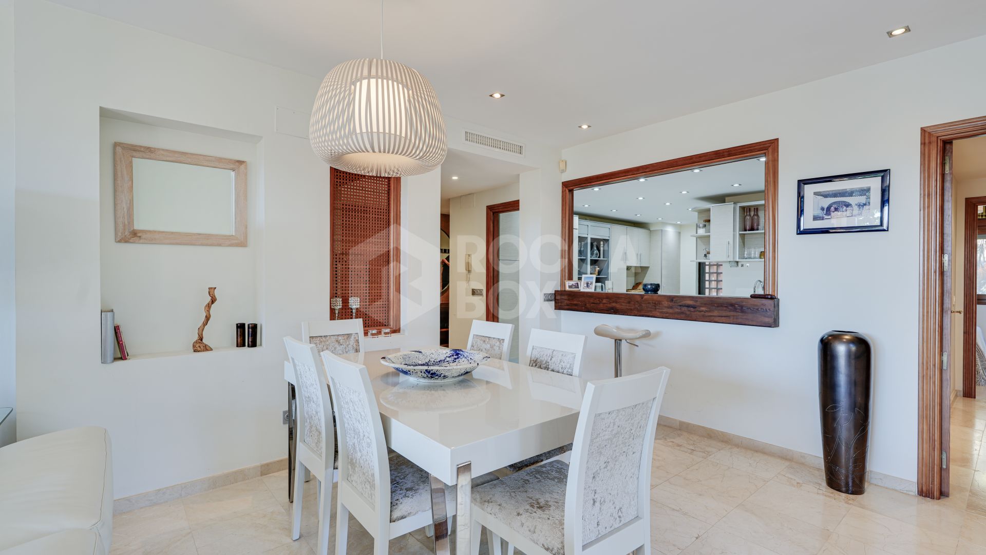 Mediterranean-style duplex penthouse with multiple terraces and a rooftop terrace with a private sauna and barbecue area